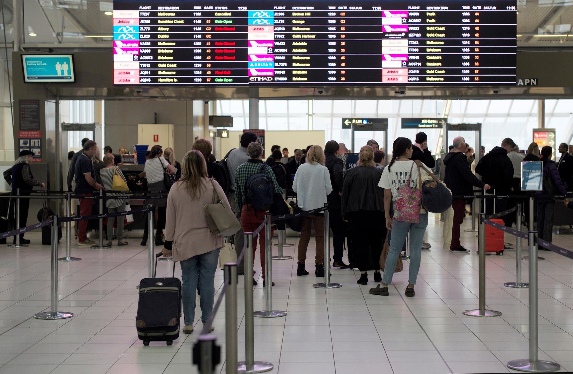 Passengers wait to undergo security checks at Sydney's Domestic Airport in Australia.