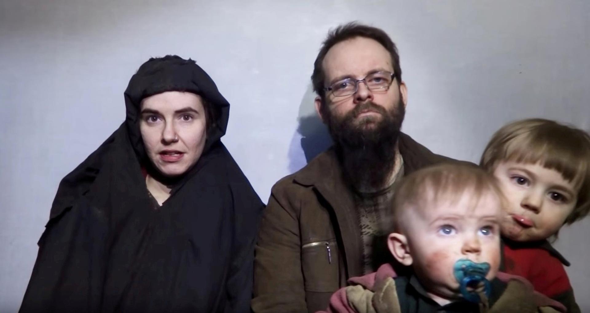 A still image from a video posted by the Taliban on social media on Dec. 19, 2016, shows American Caitlan Coleman, left, speaking next to her Canadian husband Joshua Boyle and their sons.