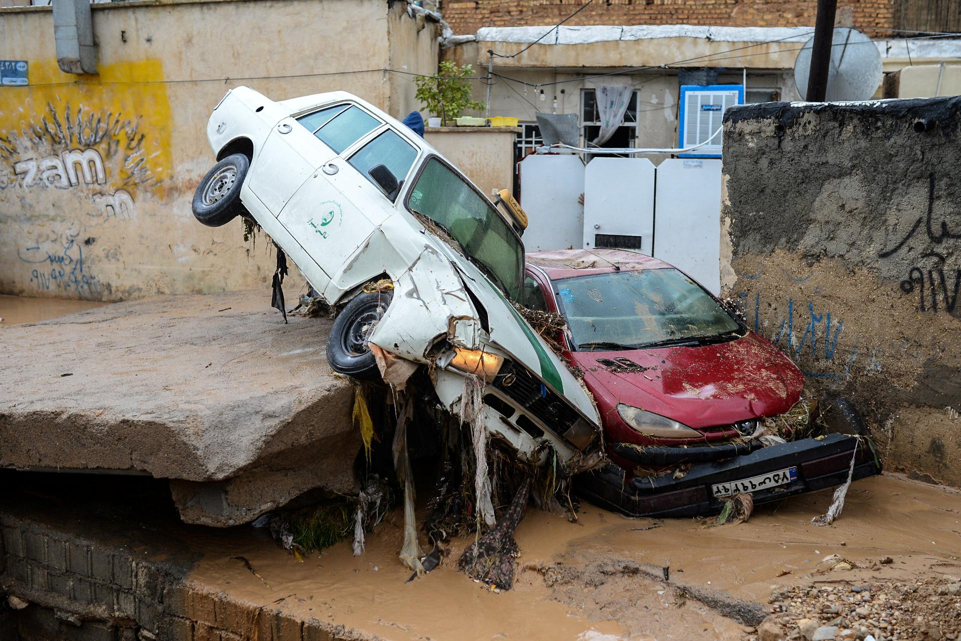 Damaged vehicles are seen after a flash flooding in Shiraz, Iran, March 26, 2019.