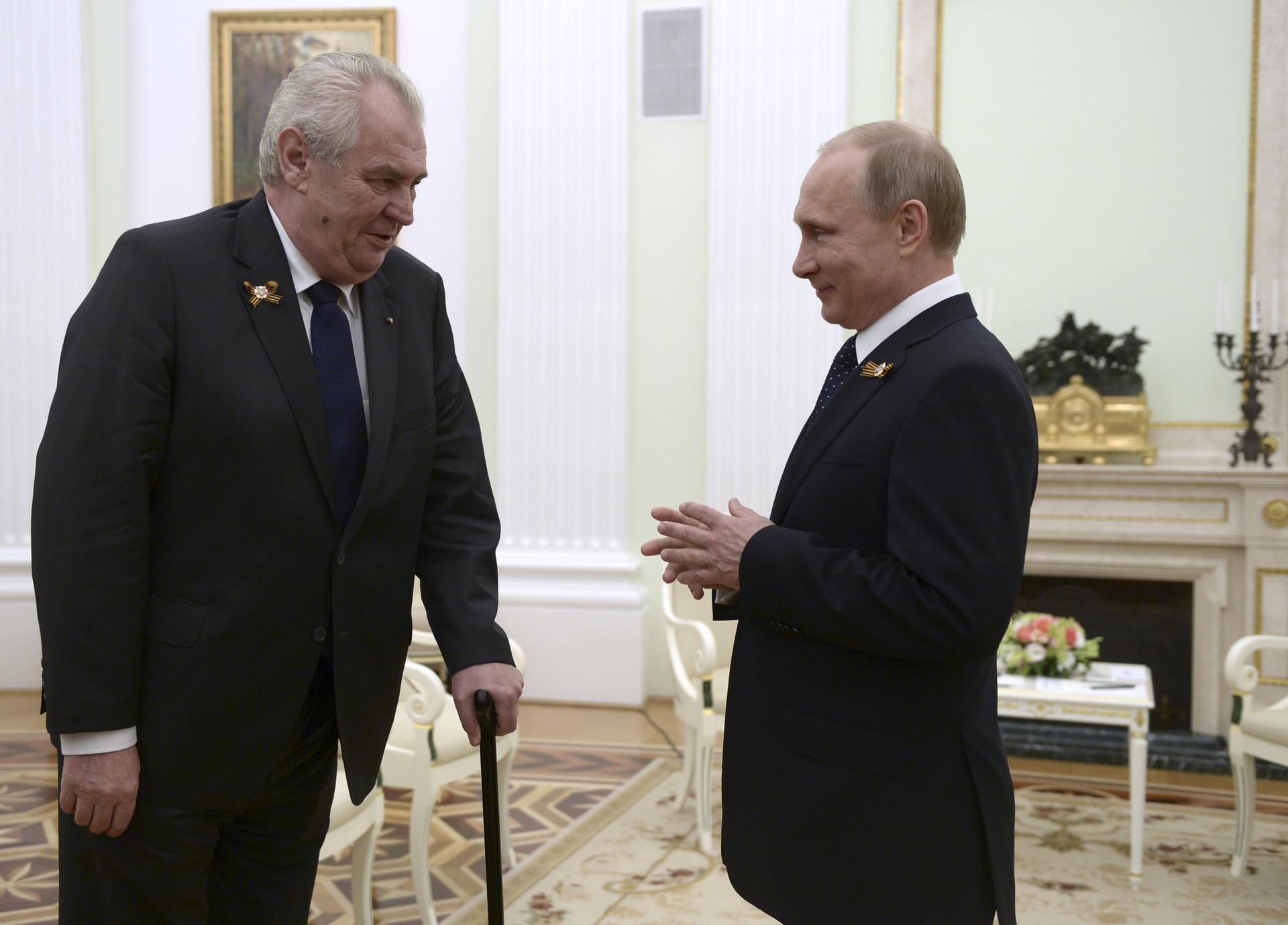 Czech President Milos Zeman, left, talks to Russian President Vladimir Putin during their meeting at the Kremlin in Moscow, Russia, on May 9, 2015.