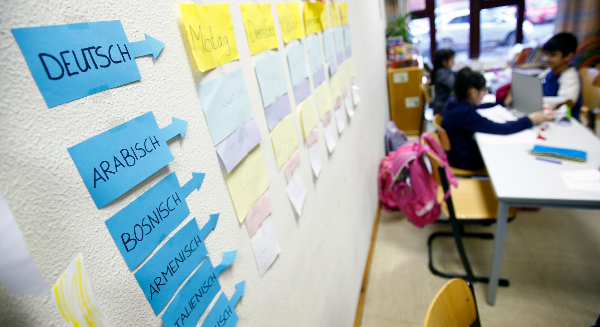 Berlin now has about 1,100 welcome classes in its more than 600 schools. Here, notes on a wall help students from different countries learn German at the Sankt Franziskus school, Jan. 22, 2016.