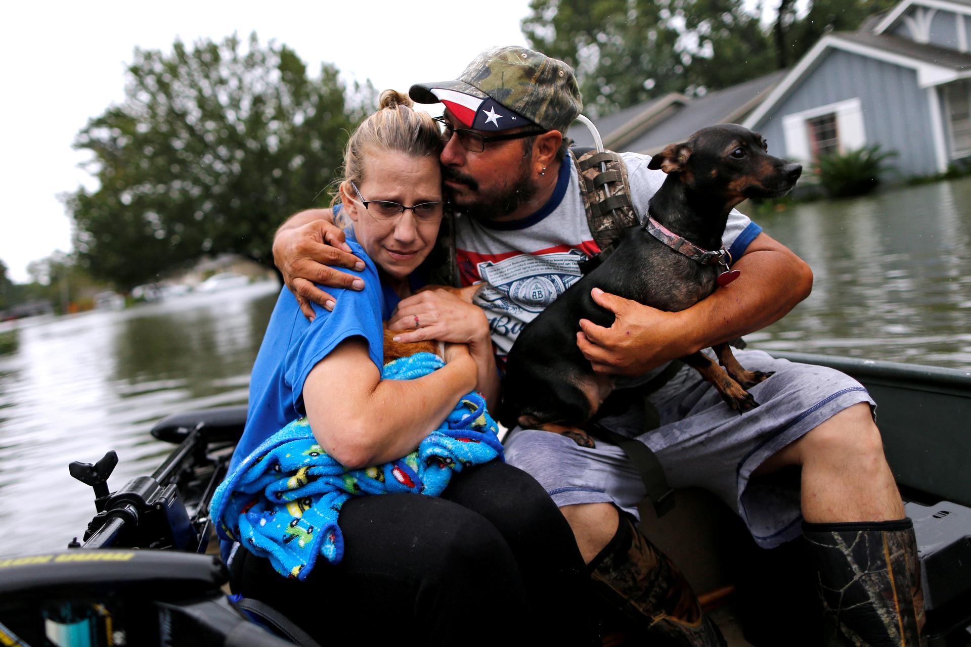 Couple in a boat in flood waters