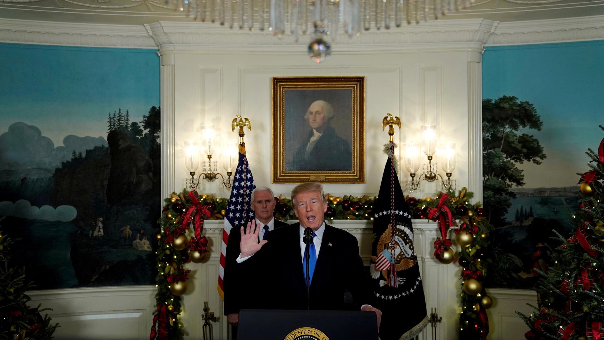 President Donald Trump, flanked by Vice President Mike Pence, delivers remarks recognizing Jerusalem as the capital of Israel at the White House in Washington, DC on December 6, 2017.