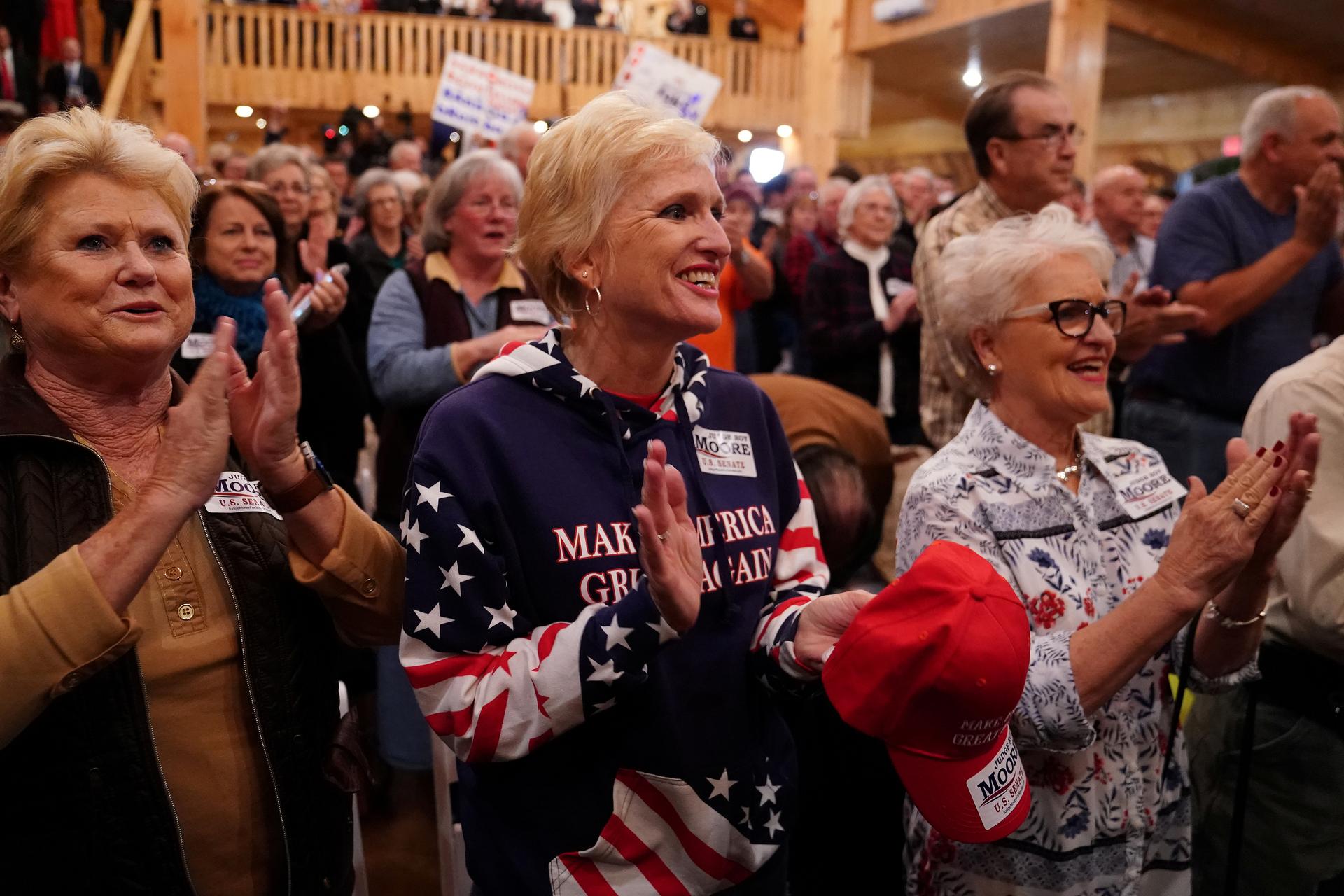 Supporters cheer at a Republican Senate candidate Roy Moore campaign rally in Midland City, Alabama.