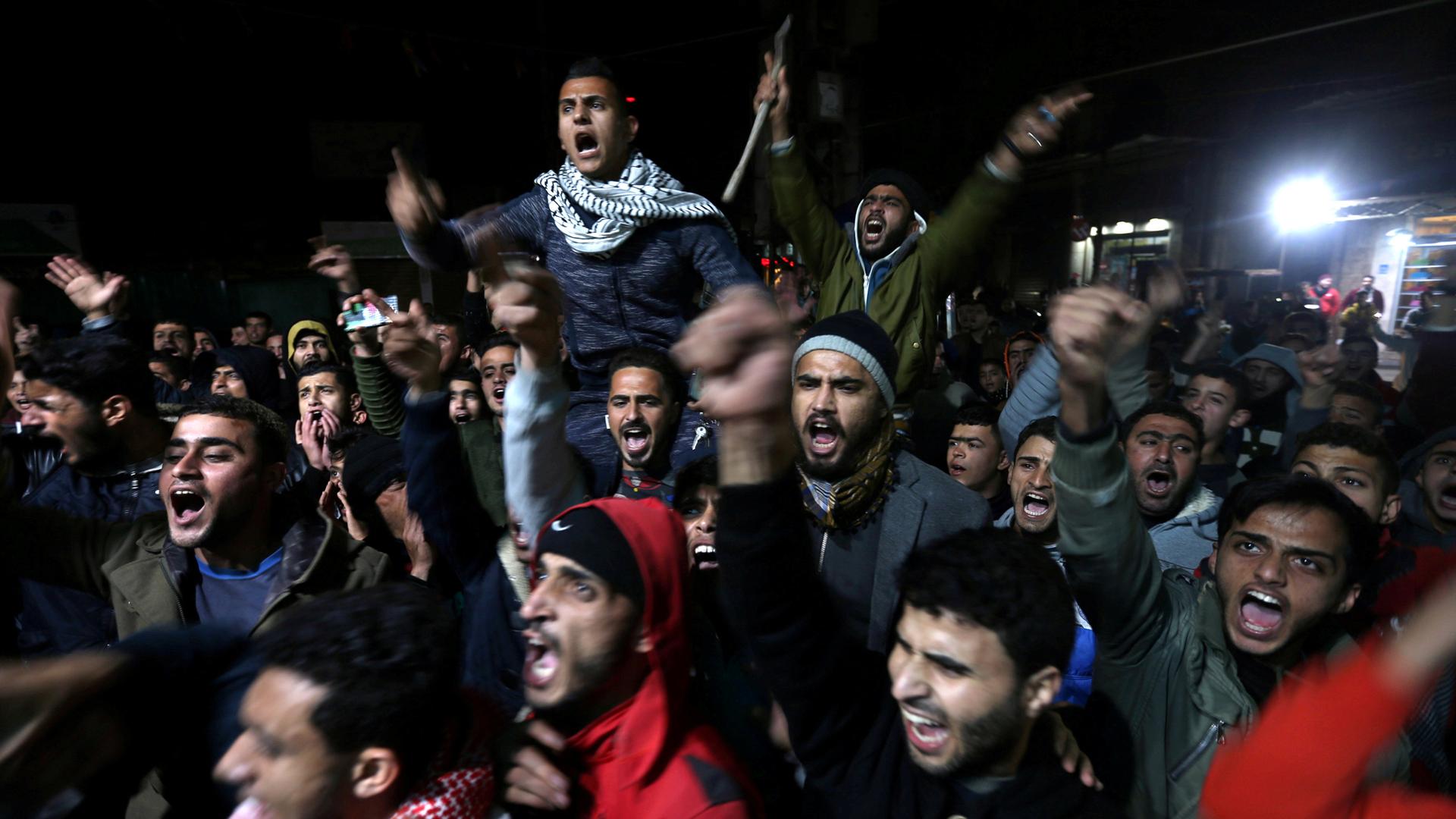 Palestinians react during a protest against Trump's decision to recognize Jerusalem as Israel's capital, in Khan Younis in the southern Gaza Strip, Dec. 7, 2017.
