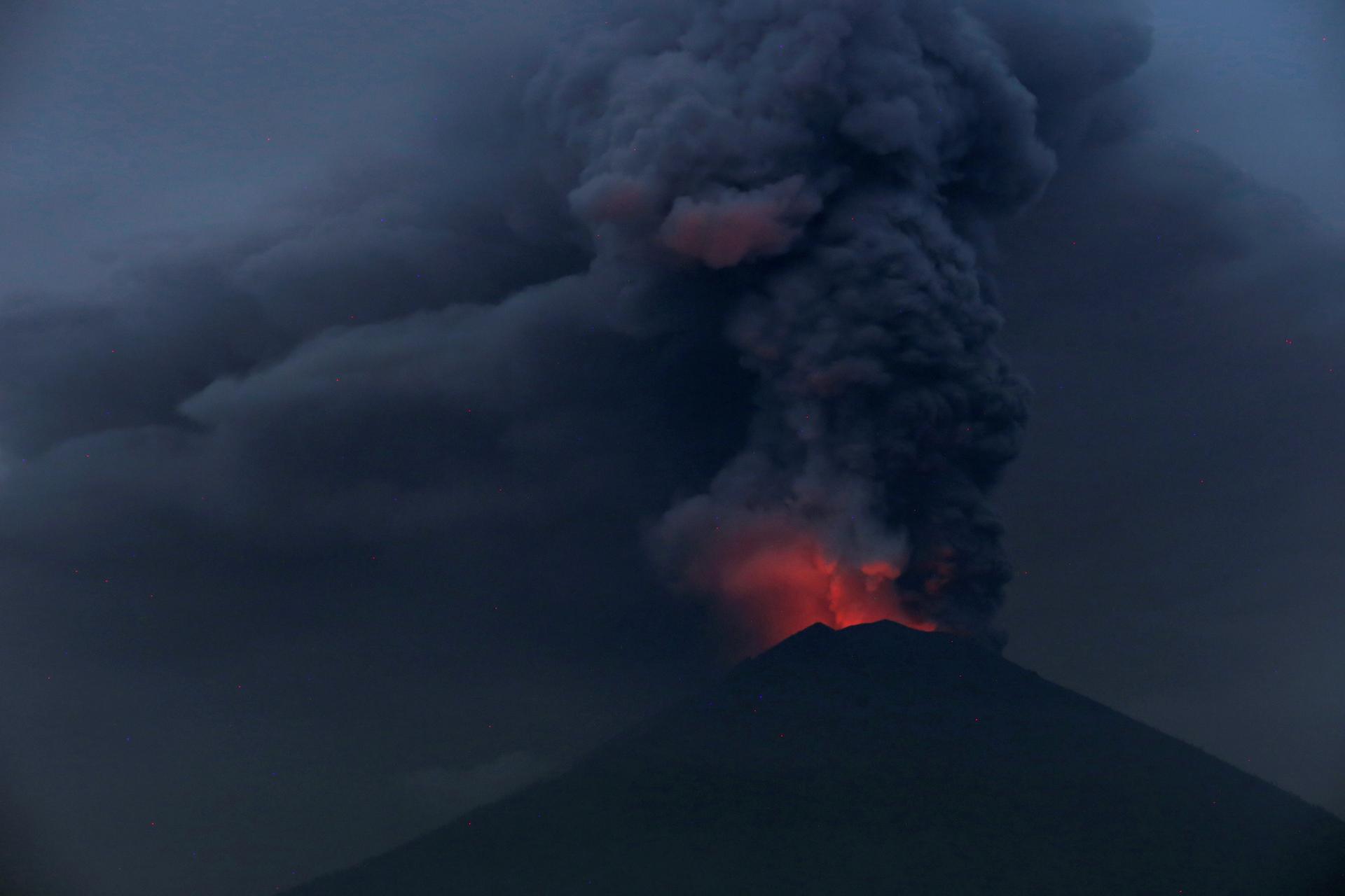 Glowing light from hot lava is seen during the eruption of Mount Agung in Bali, Indonesia, Nov. 27, 2017.