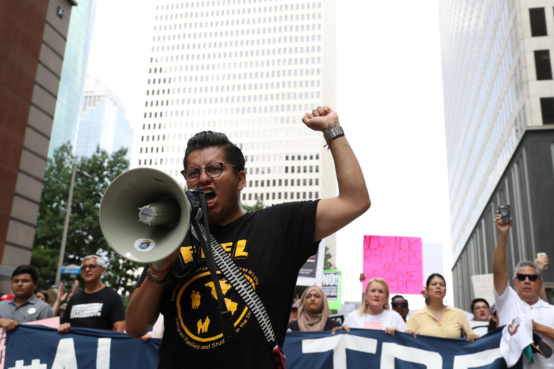 Cesar Espinosa, an immigrant rights' activist and head of FIEL, leads demonstrators protesting the Trump administration's immigration policies as part of a "Families Belong Together" rally in Houston, Texas, June 30, 2018.