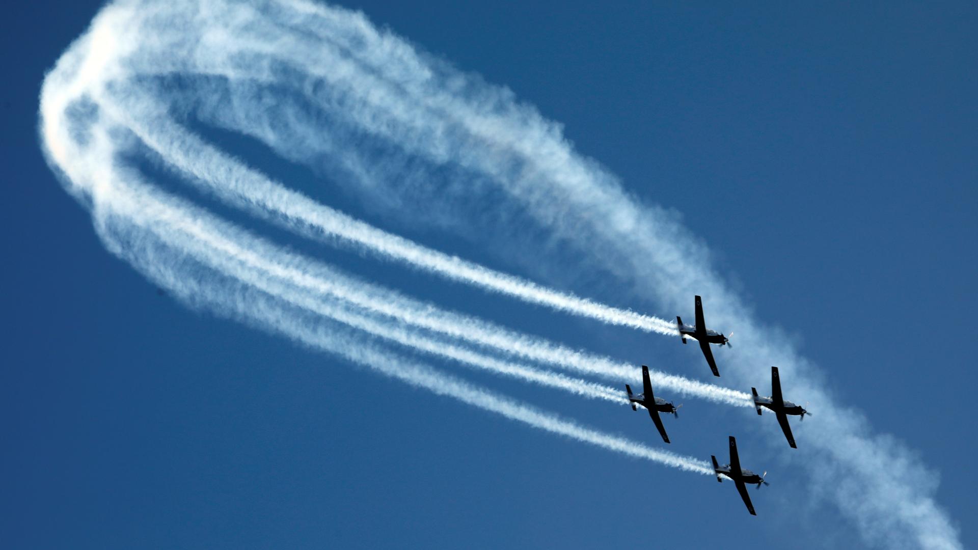 Israeli Air Force T-6 Texan II planes fly in formation during an aerial demonstration at a graduation ceremony for Israeli air force pilots at the Hatzerim air base in southern Israel December 26, 2018.
