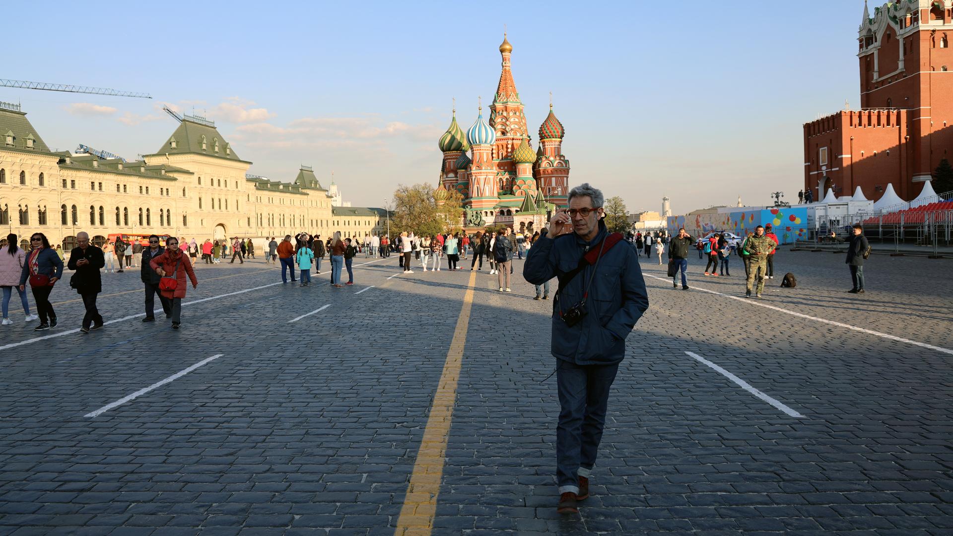 Marco Werman walks across Red Square in Moscow. Behind him is the iconic St. Basil's Cathedral. 