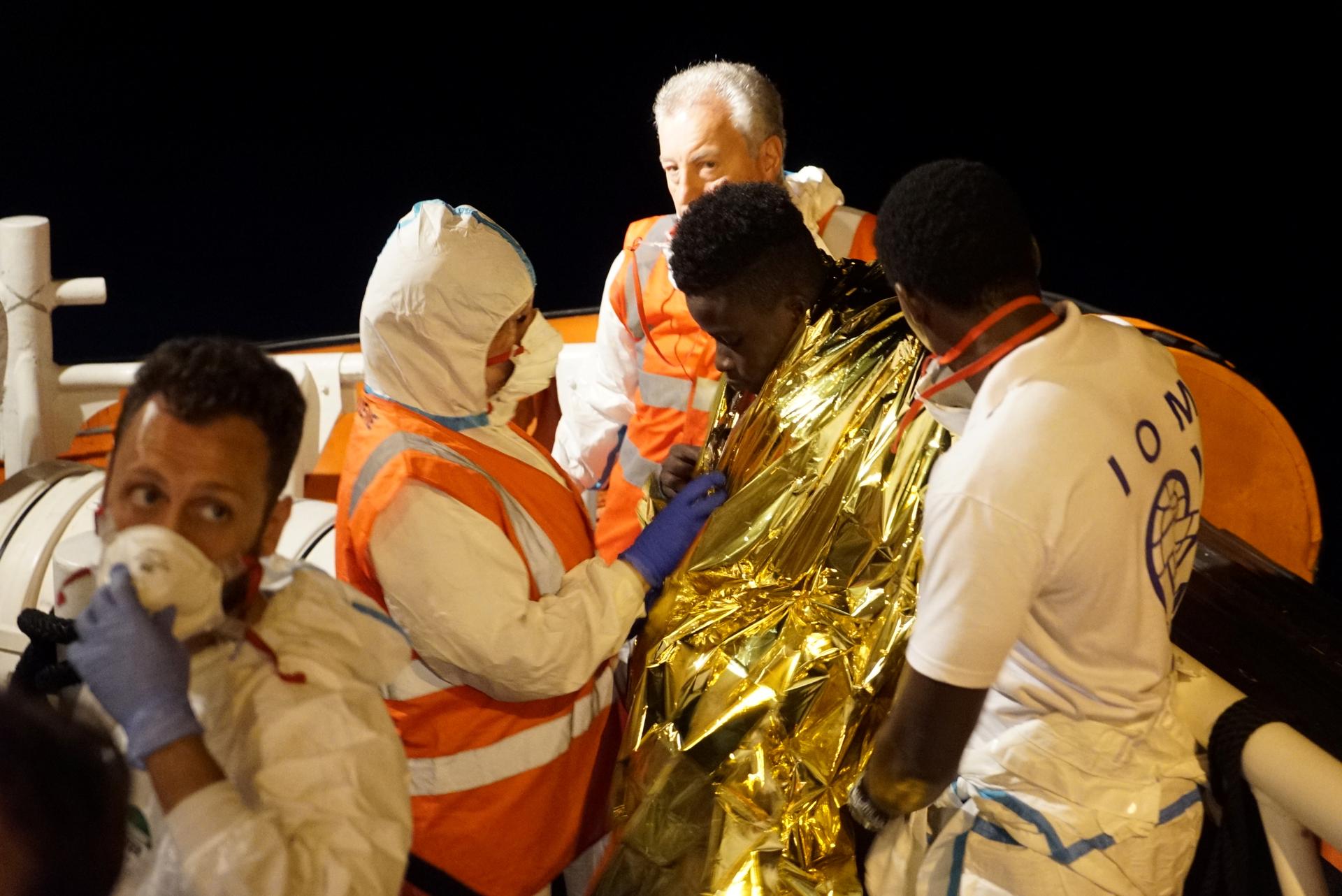 a migrant is rescued at sea