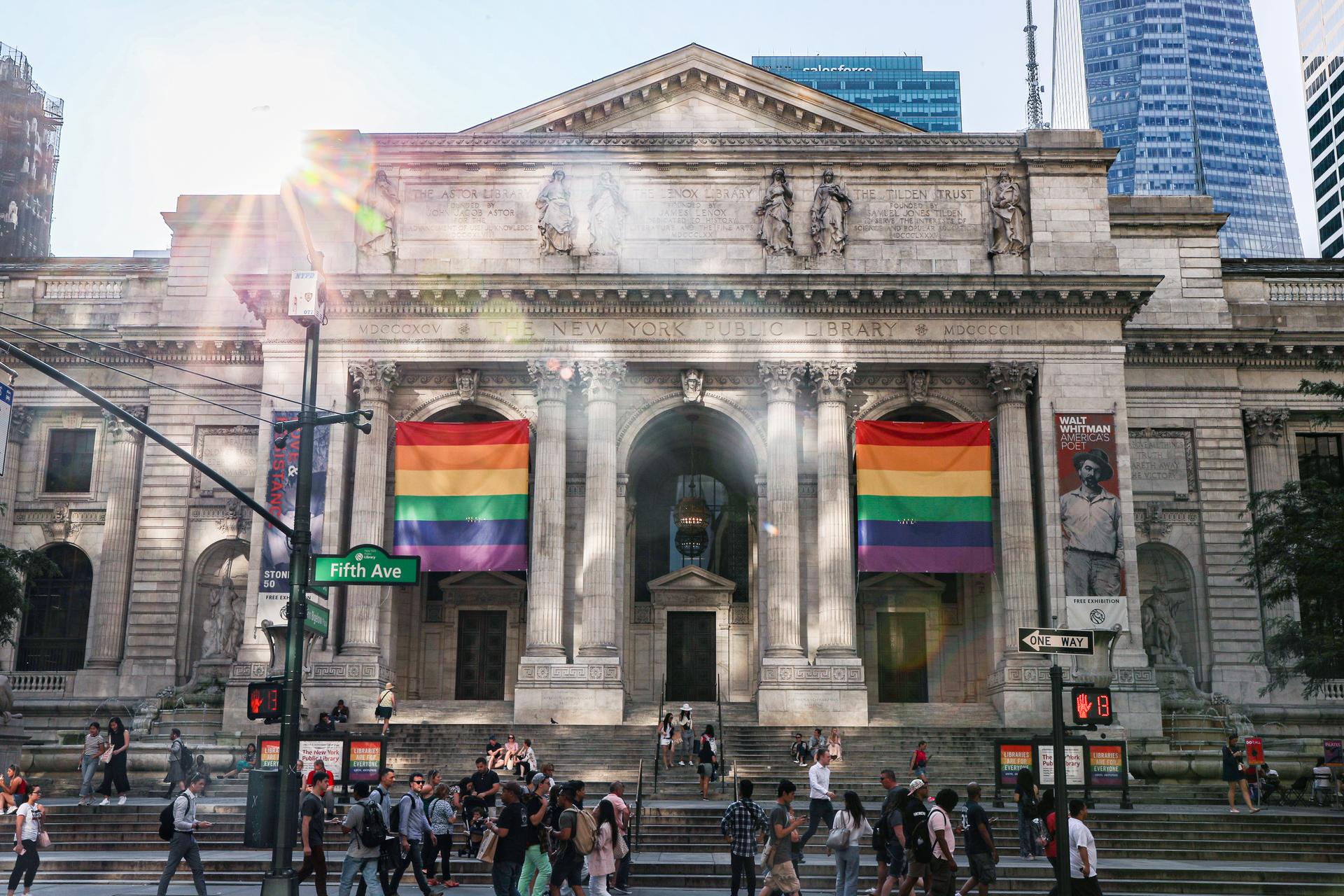 Pride flags are hung in front of the New York Public Library.