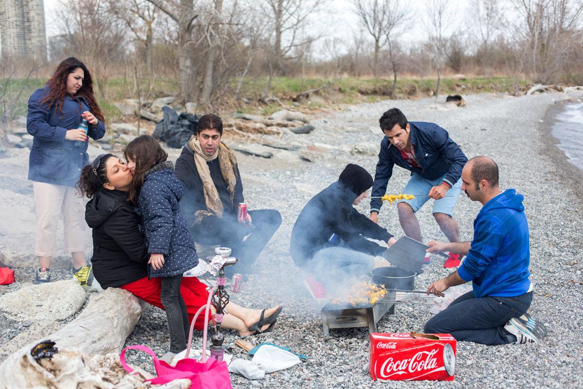 Small group of Iranian refugee families on a Sunday picnic at Toronto Humber Bay Park.