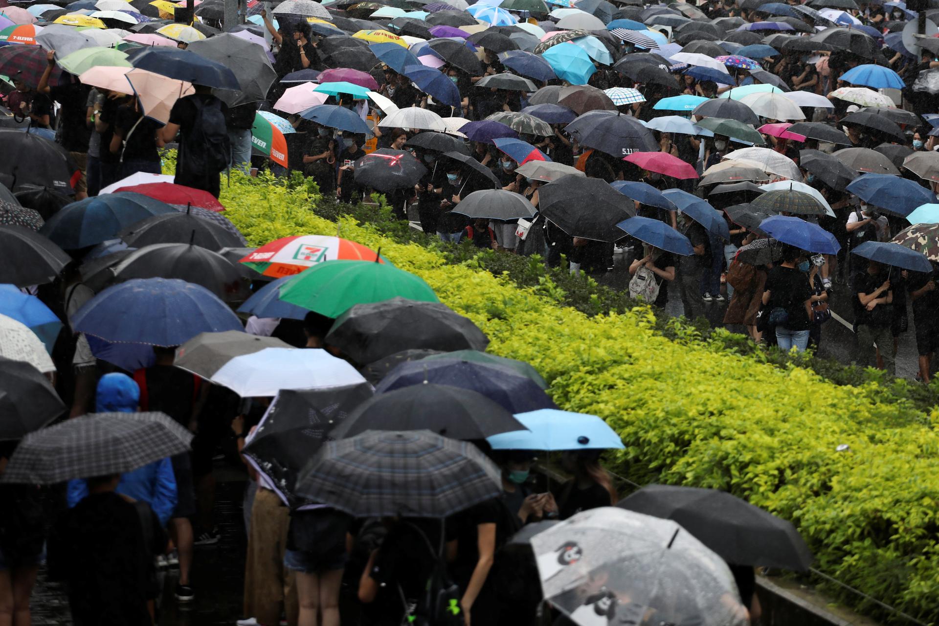 Hong Kong protesters carry umbrellas – a symbolic reminder of the 2014 Umbrella Movement, June 17, 2019.