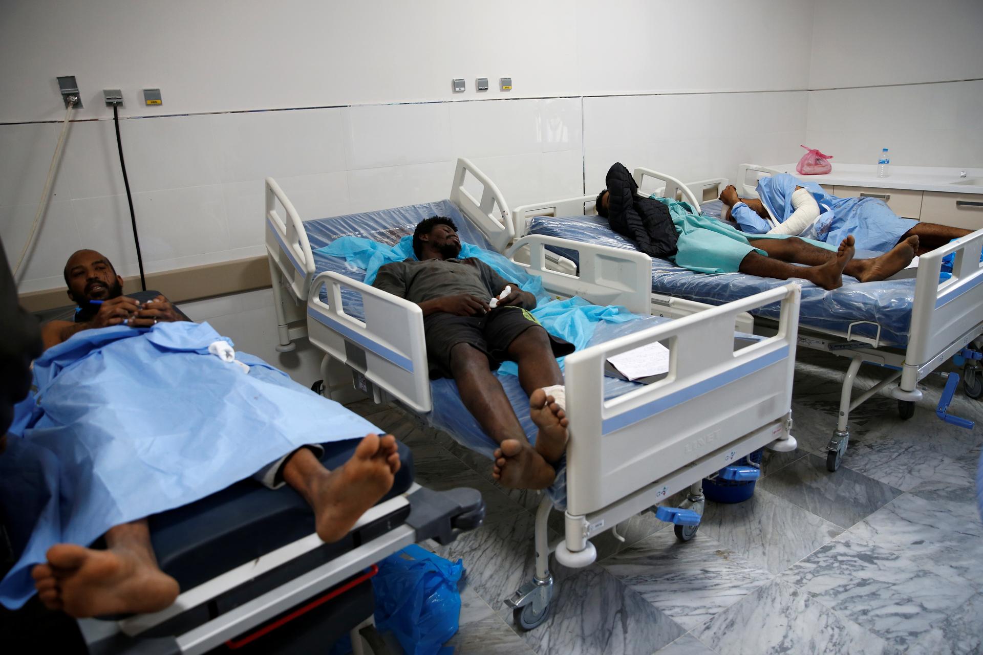 Wounded migrants lie on hospital beds after an air strike hit a detention center for mainly African migrants in Tajoura, in Tripoli Central Hospital, Libya, July 3, 2019.