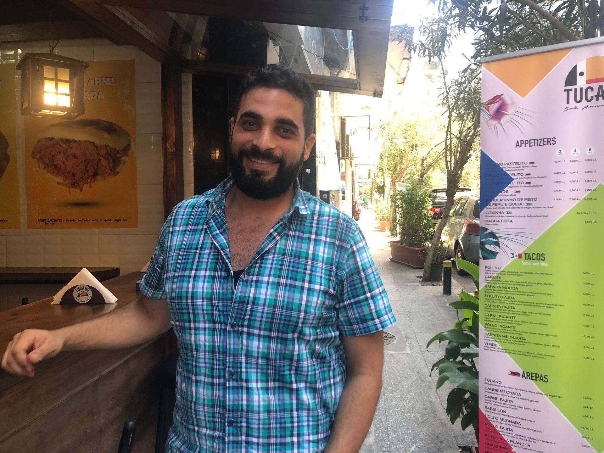 Firas Yordi, a Venezuelan of Lebanese descent, in front of his new restaurant in Beirut. He returned to his parents' homeland last year amidst Venezuela's financial crisis. 