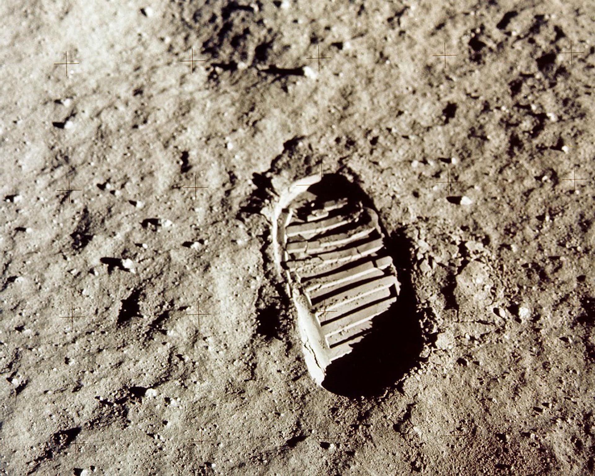 The oval tread of an astronaut's footprint is shown on the the lunar soil.