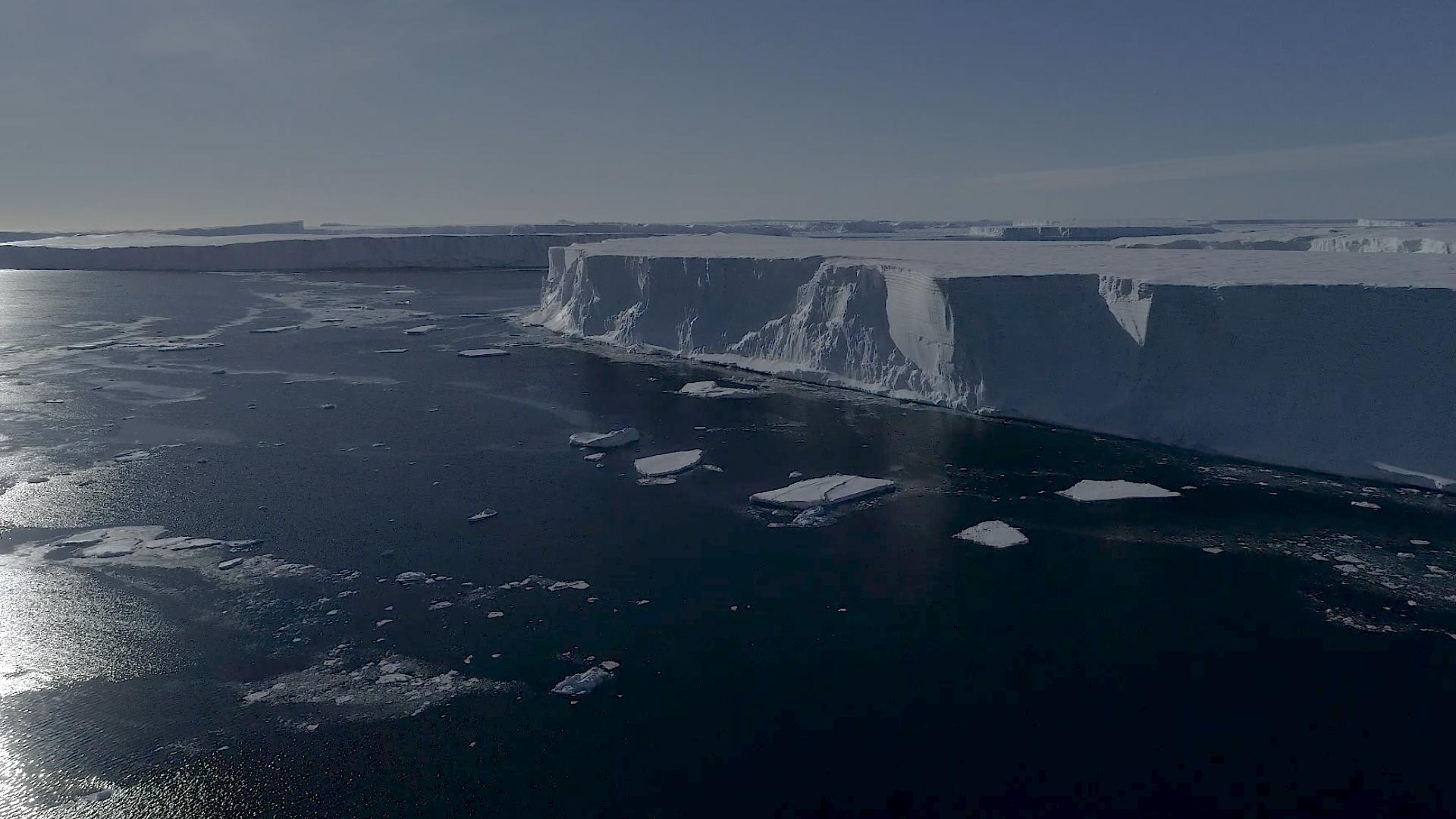 Drone footage shows large icebergs that have recently broken off the ice shelf in West Antarctica. 