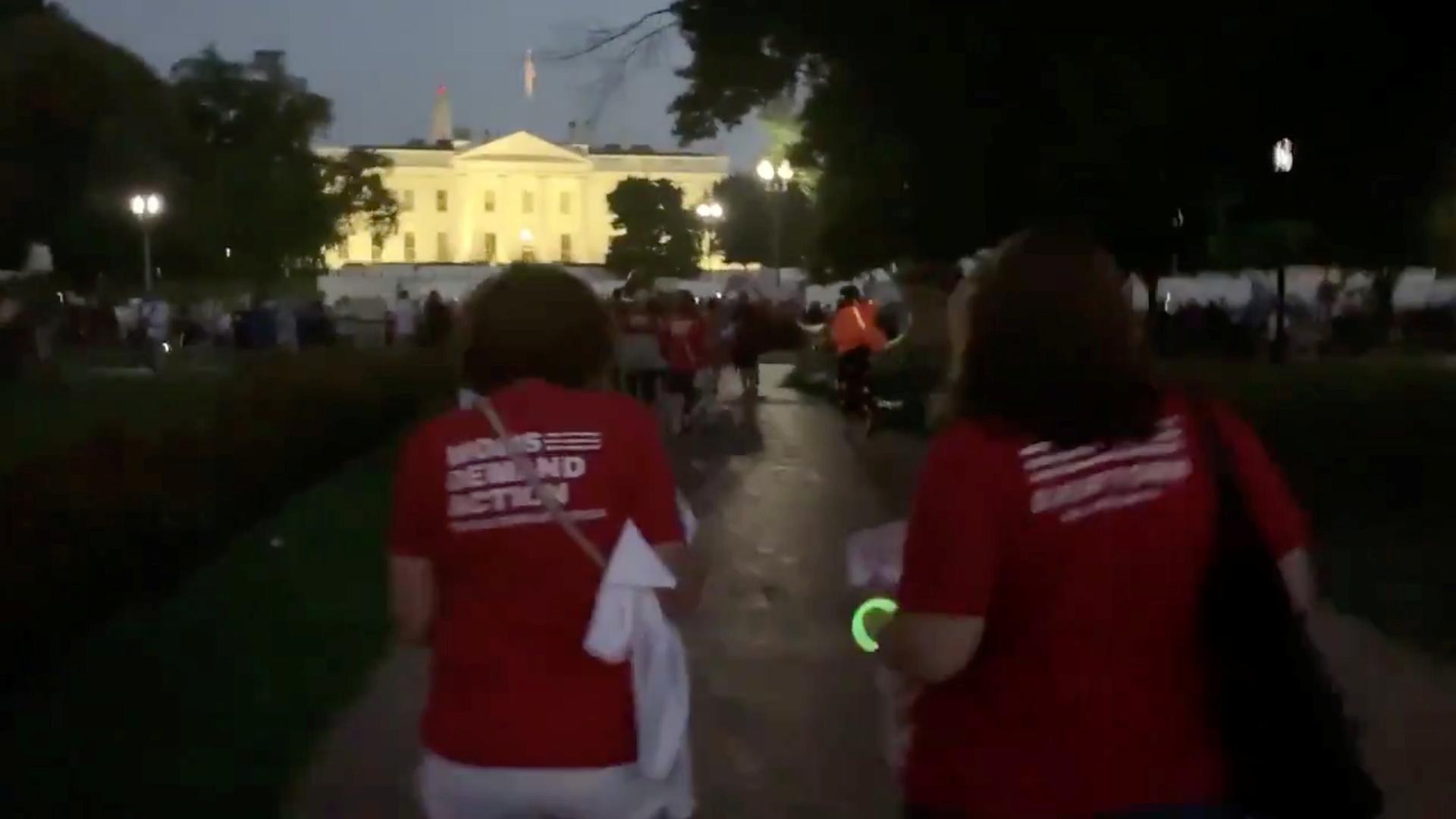 Mothers wearing red T-shirts march on the White House