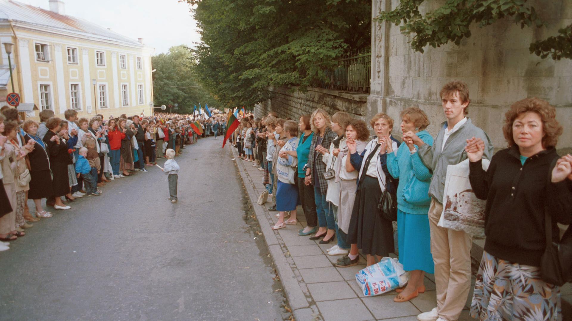 Thousands of people make a human chain from Pikk Hermann in Tallinn, Estonia, to Gediminas' Tower in Vilnius, Lithuania, on Aug. 23 in 1989.