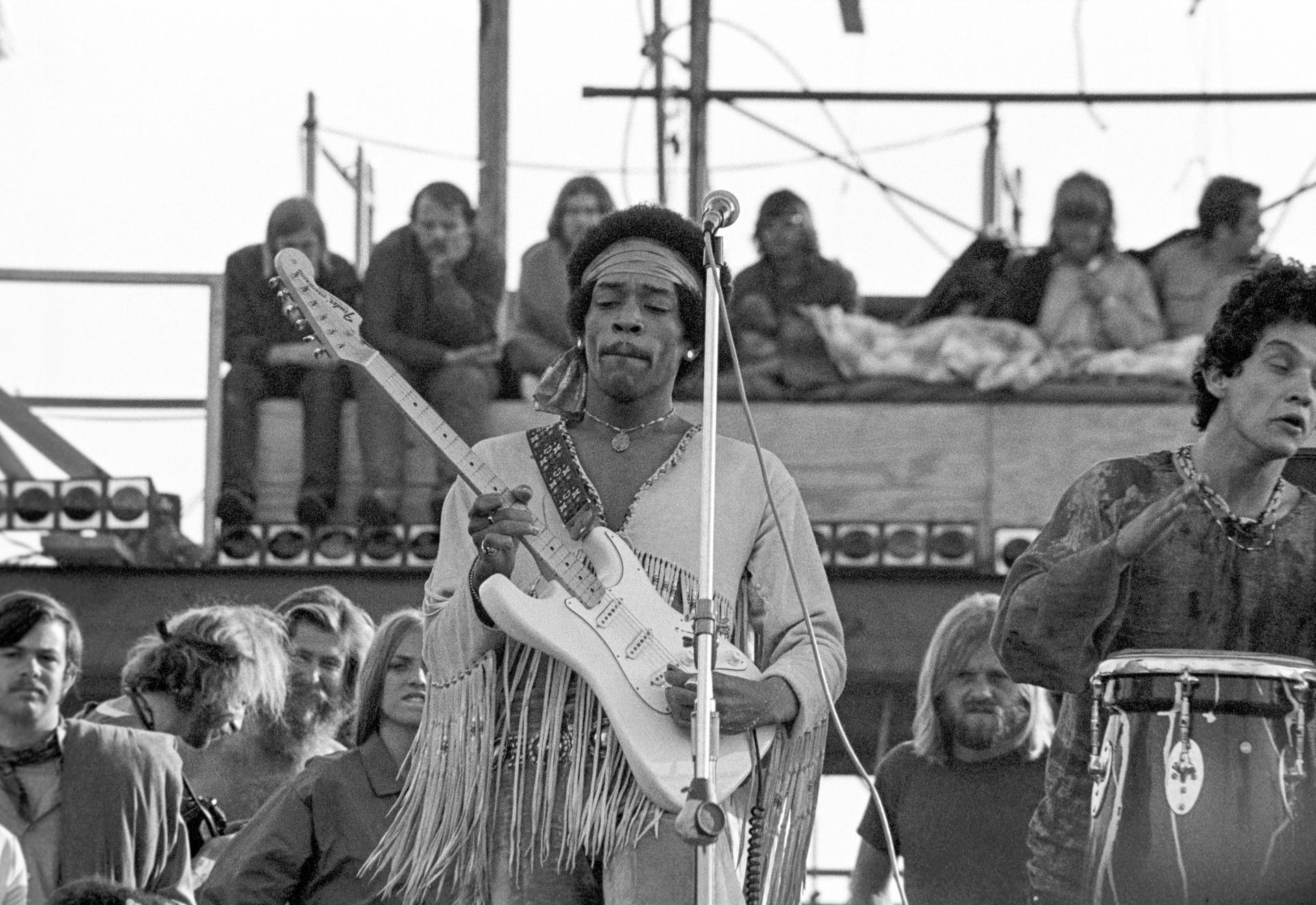 Jimi Hendrix plays at Woodstock.