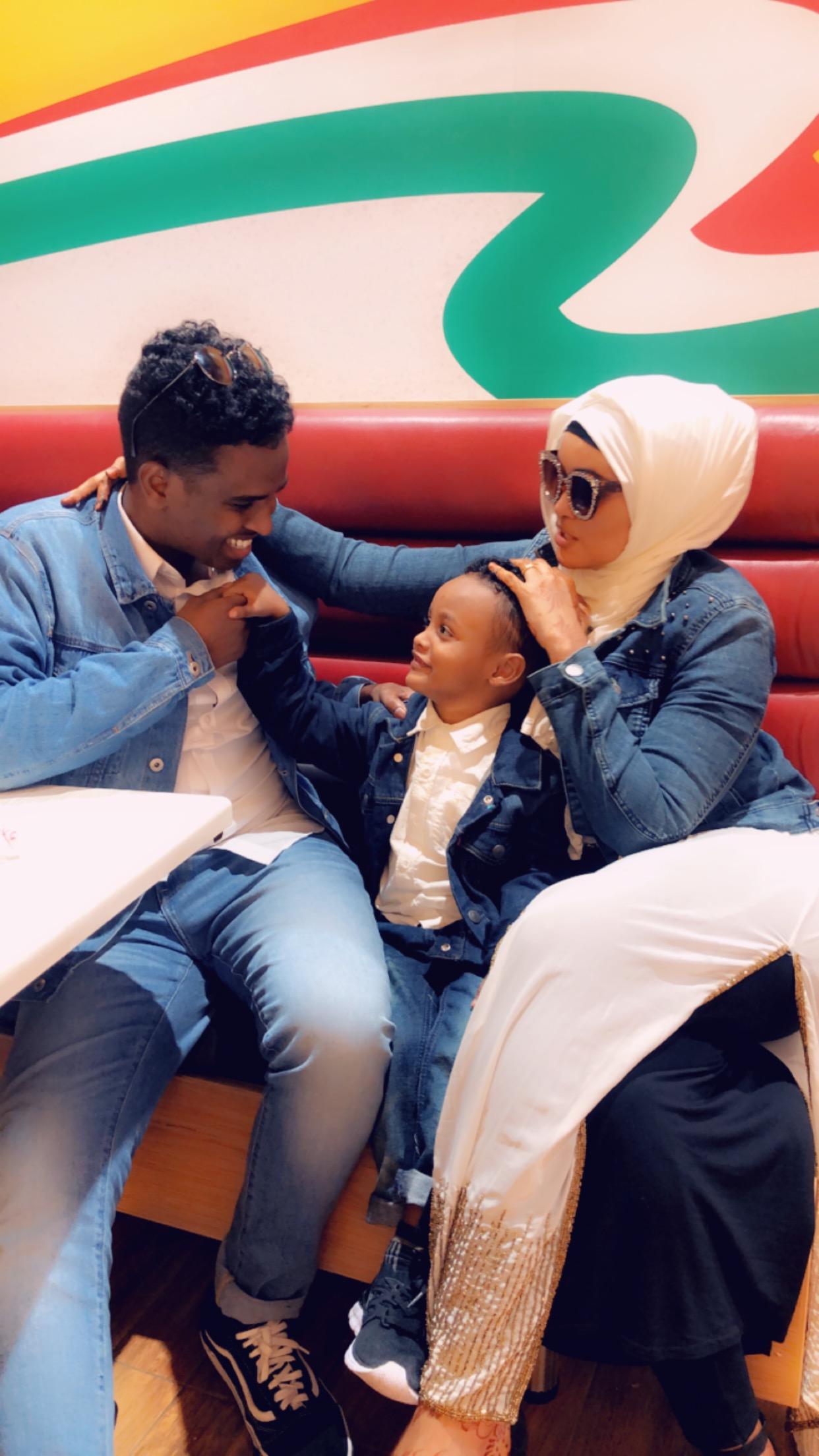 A Somali refugee family sitting in Nairobi, Kenya.
