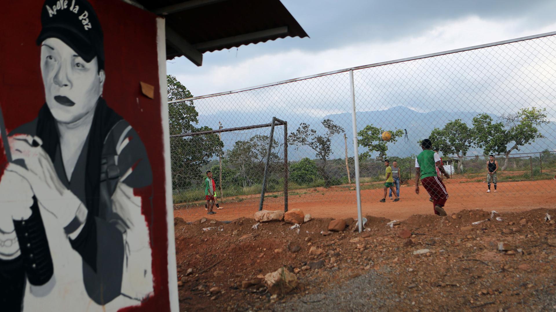 Former rebels of the Revolutionary Armed Forces of Colombia play football at a camp