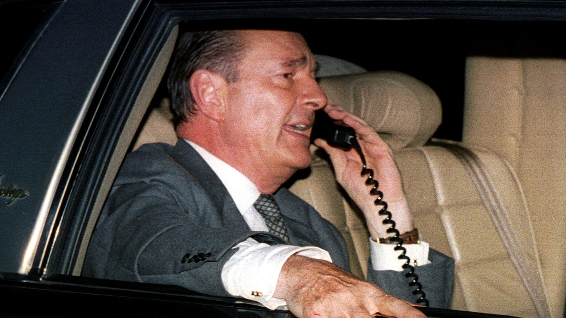 Newly elected French President Jacques Chirac talks on his car phone in Paris.