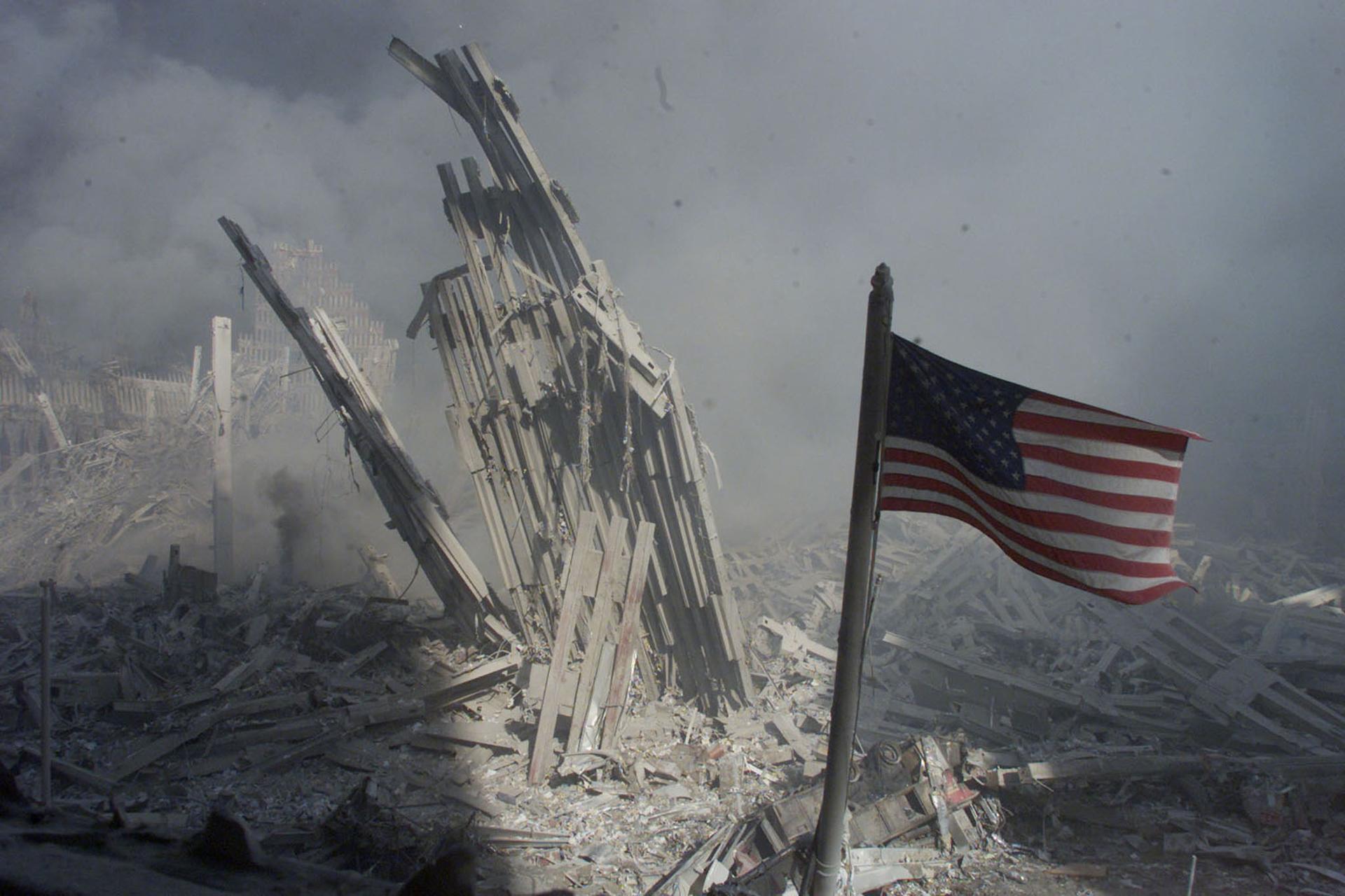 Rubble is highlighted and an American flag is in the foreground