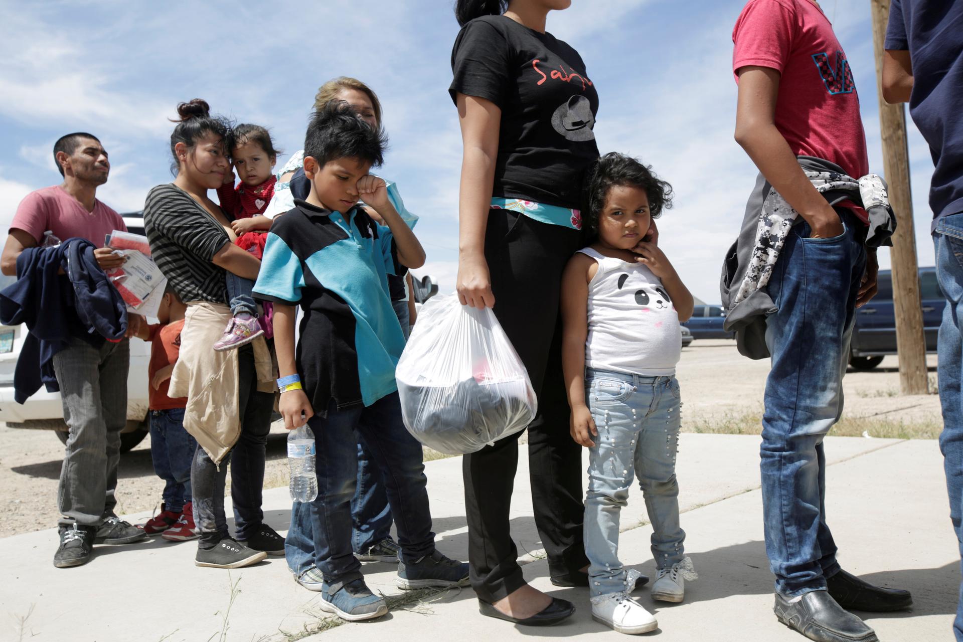Central American migrants stand in line before entering a temporary shelter, after illegally crossing the border between Mexico and the U.S., in Deming, New Mexico, on May 16, 2019.