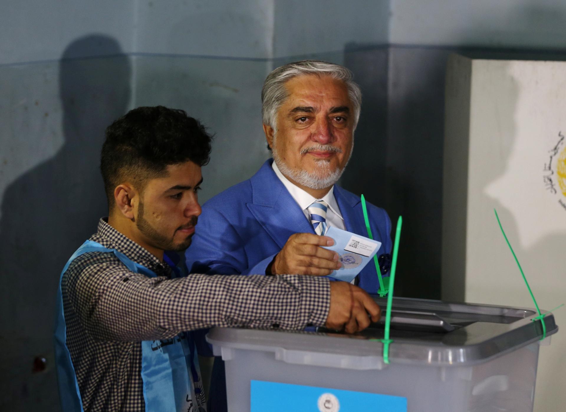 Afghan presidential candidate Abdullah Abdullah casts his vote at a polling station in Kabul, Afghanistan.