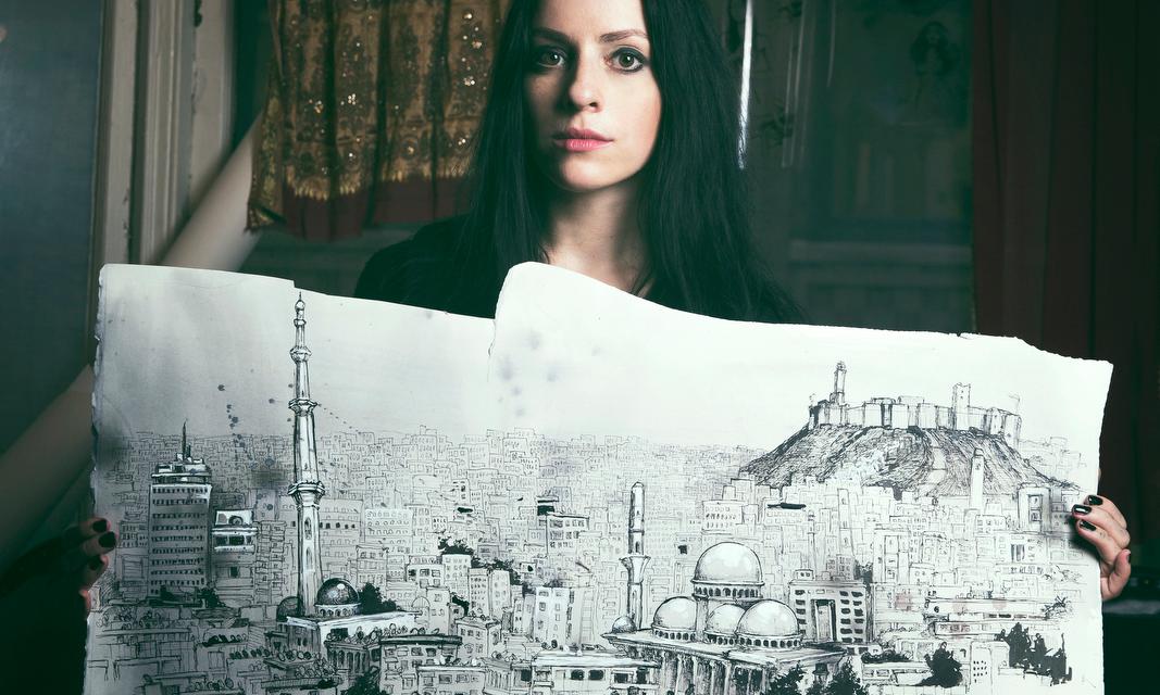 Molly Crabapple holds one of her drawings from her book “Brothers of the Gun: A Memoir of the Syrian War.”