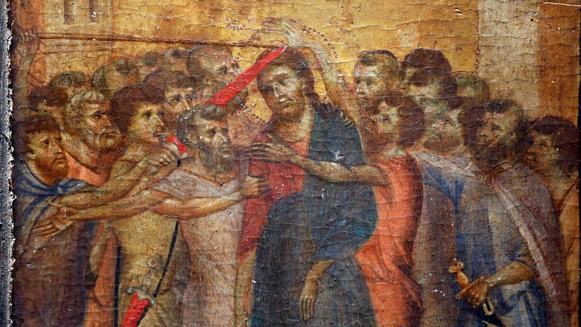 A renaissance-era painting shows Jesus surrounded by other people, some of whom are holding swords