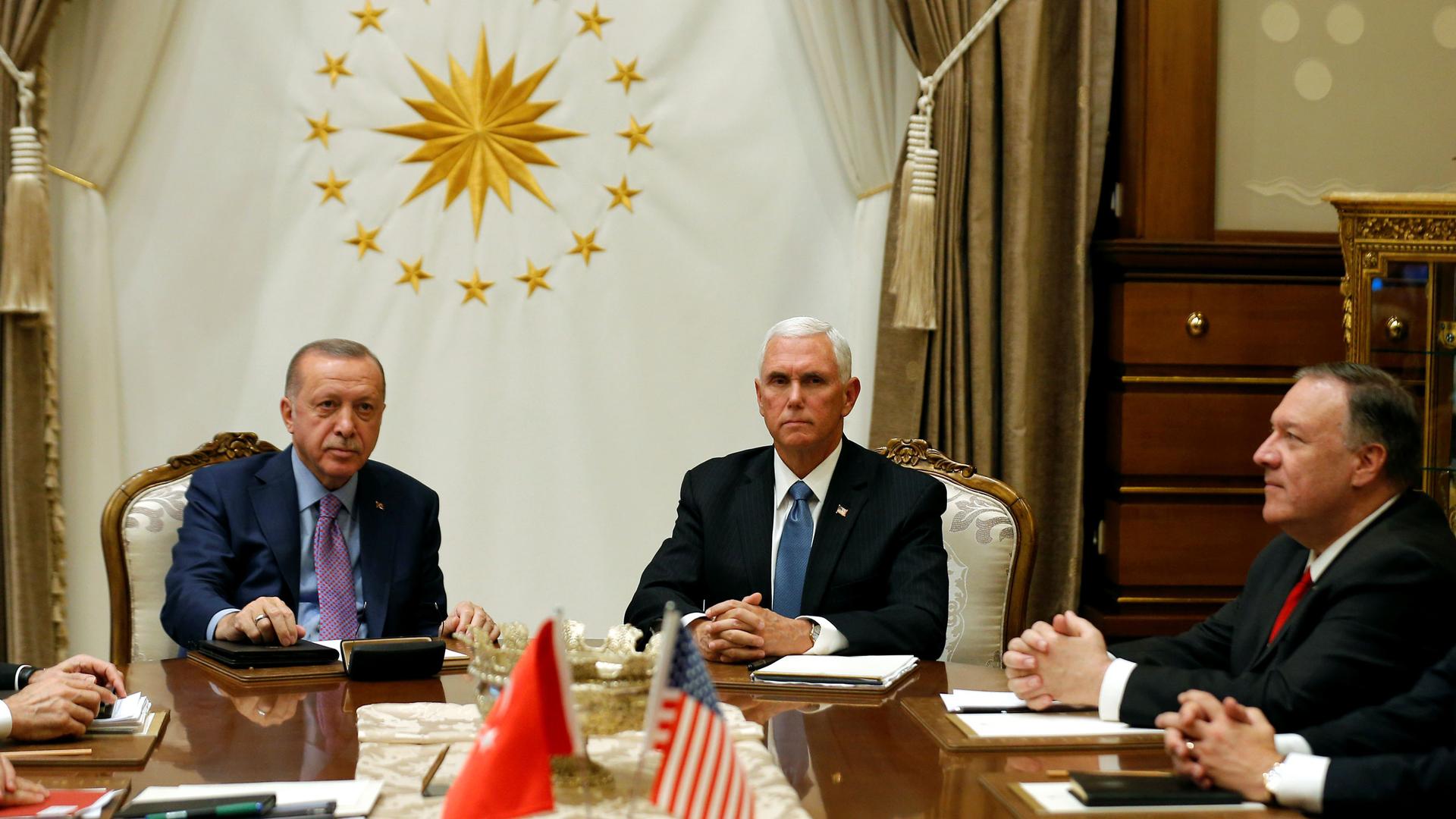 US Vice President Mike Pence and Secretary of State Mike Pompeo sit around a table with Turkish President Tayyip Erdogan 