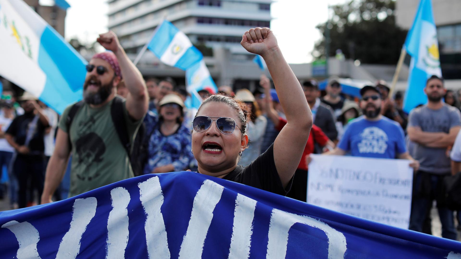A female protester raises her fist as she takes part in a march to protest against the decision of Guatemala President Jimmy Morales to end the mandate of the UN-backed anti-graft commission, the CICIG, in Guatemala City, Guatemala, January 12, 2019.