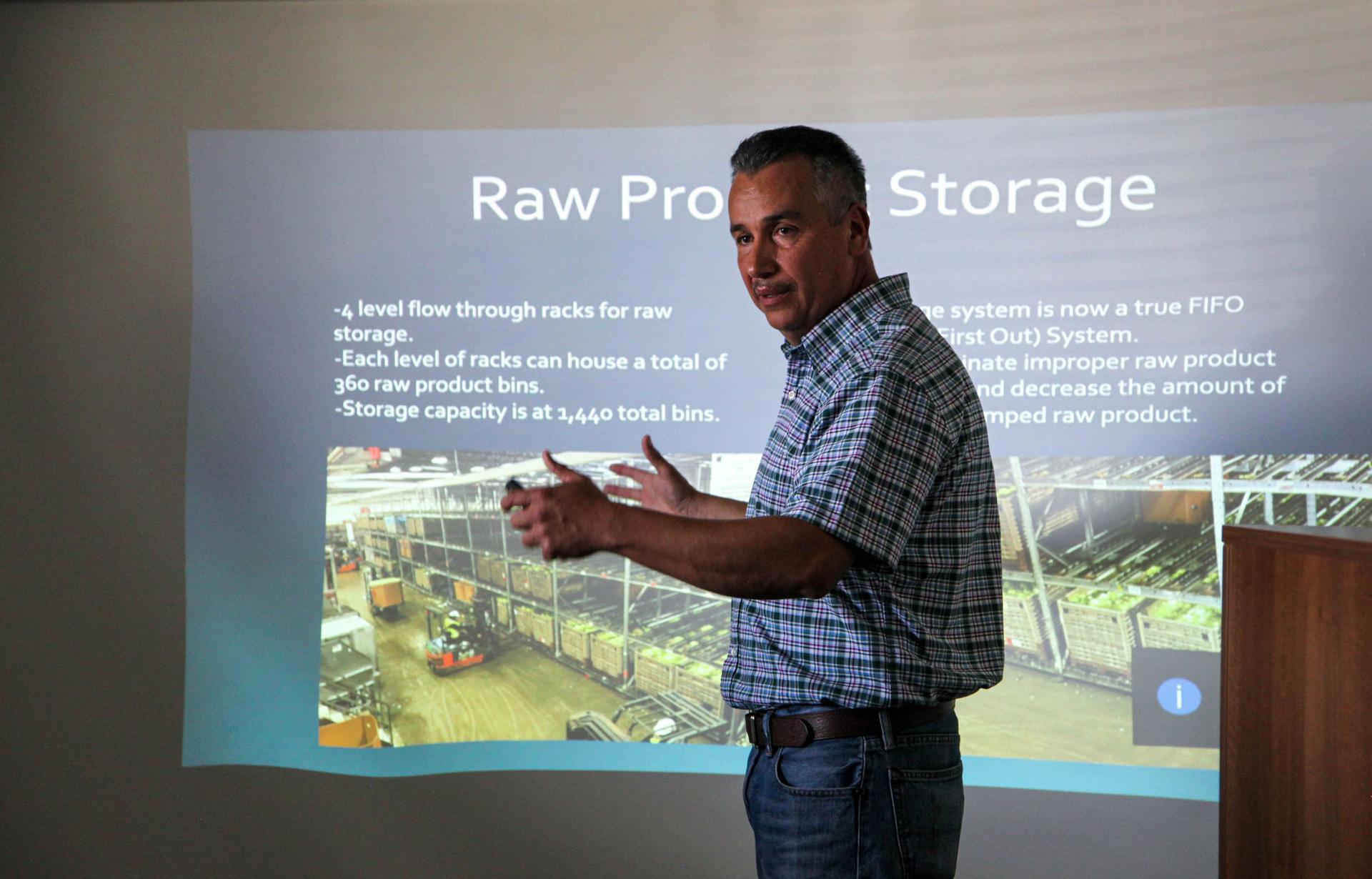 Matias Ramirez, director of facilities and automation at Taylor Farms, gives a presentation on September 10, 2019, about the new technology the company is putting in place at its processing facility.