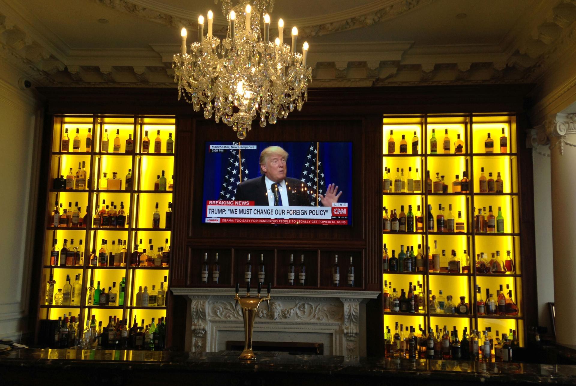 A TV screen on a bar shows US President Donald Trump