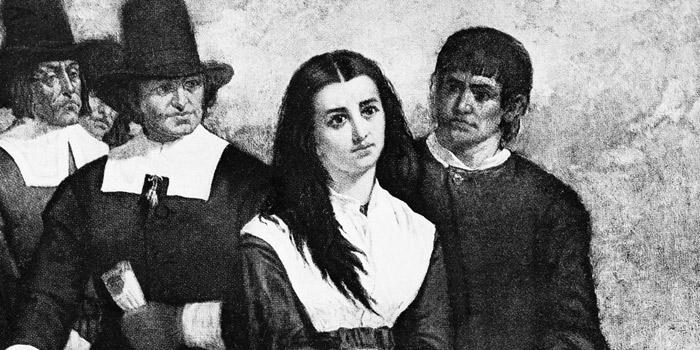 A black-and-white section of a painting of a woman surrounded by men in Puritan garb. 