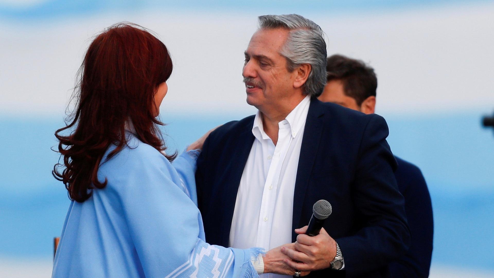 Argentina's presidential candidate Alberto Fernández and his running mate former President Cristina Kirchner embrace each other during a closing campaign rally in Mar del Plata, Argentina, Oct. 24, 2019. 