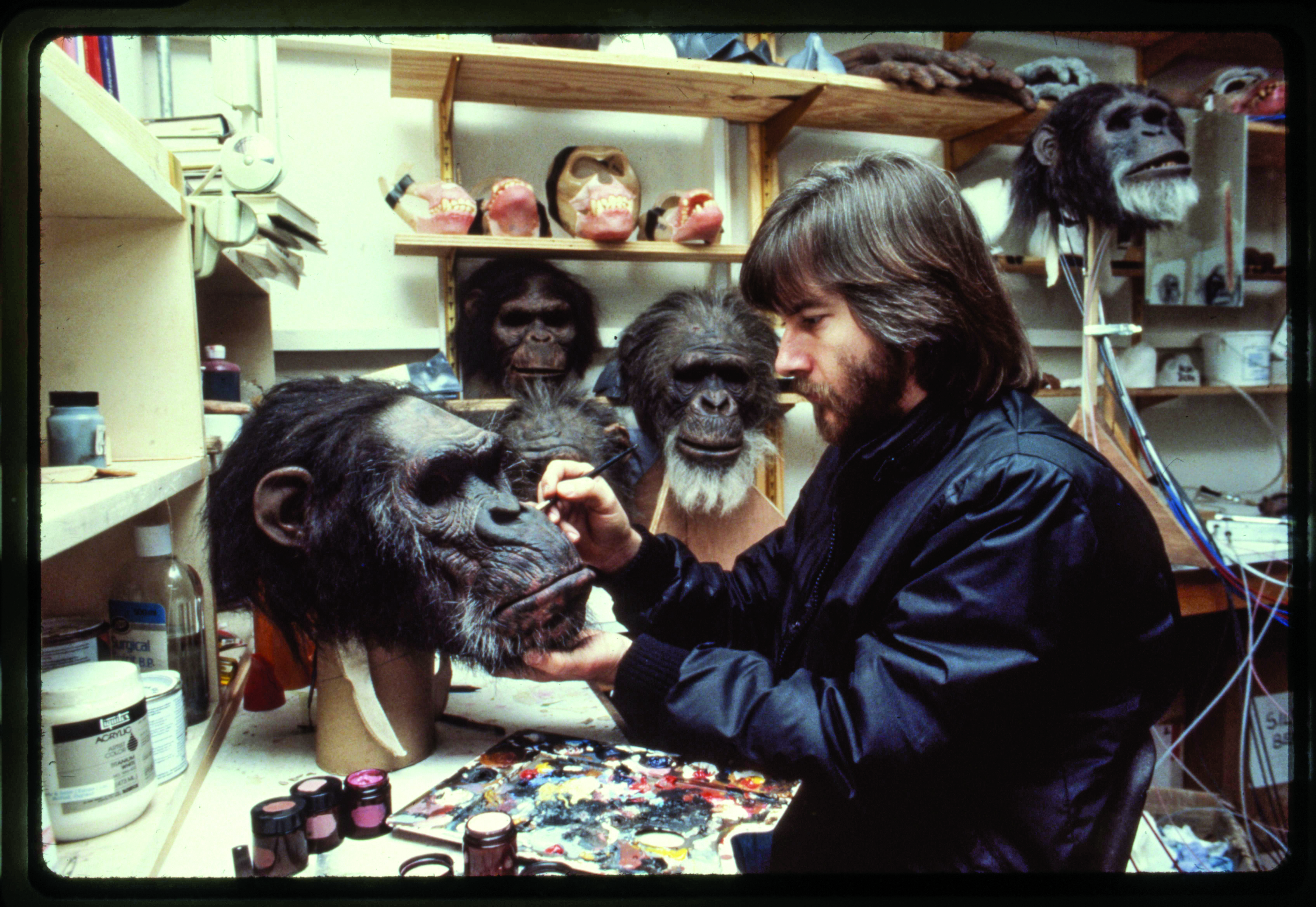 Rick Baker in his workshop on Stage 5 at Elstree Studios, touching up the paint on White Eyes, from the movie “Greystoke: The Legend of Tarzan, Lord of the Apes.”