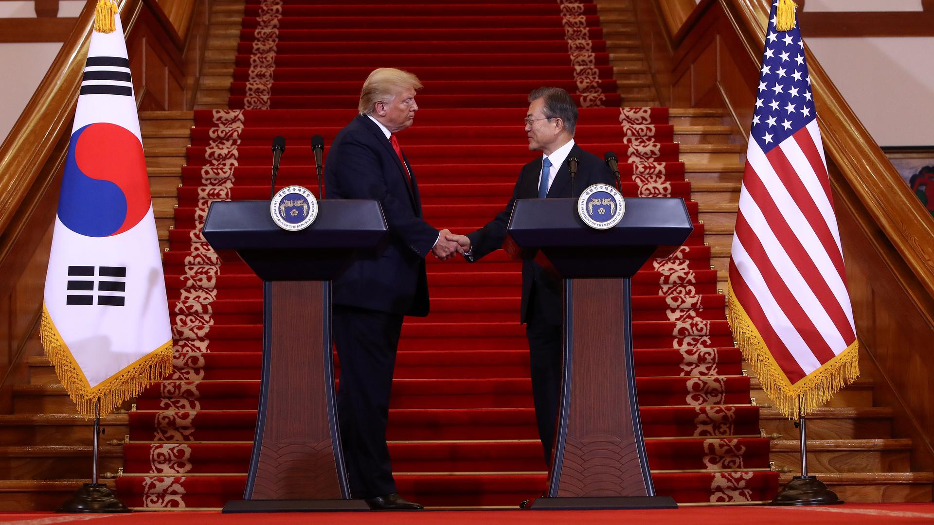 US President Donald Trump, left, greets South Korean President Moon Jae-in during a joint news conference at the presidential Blue House on June 30, 2019 in Seoul, South Korea.