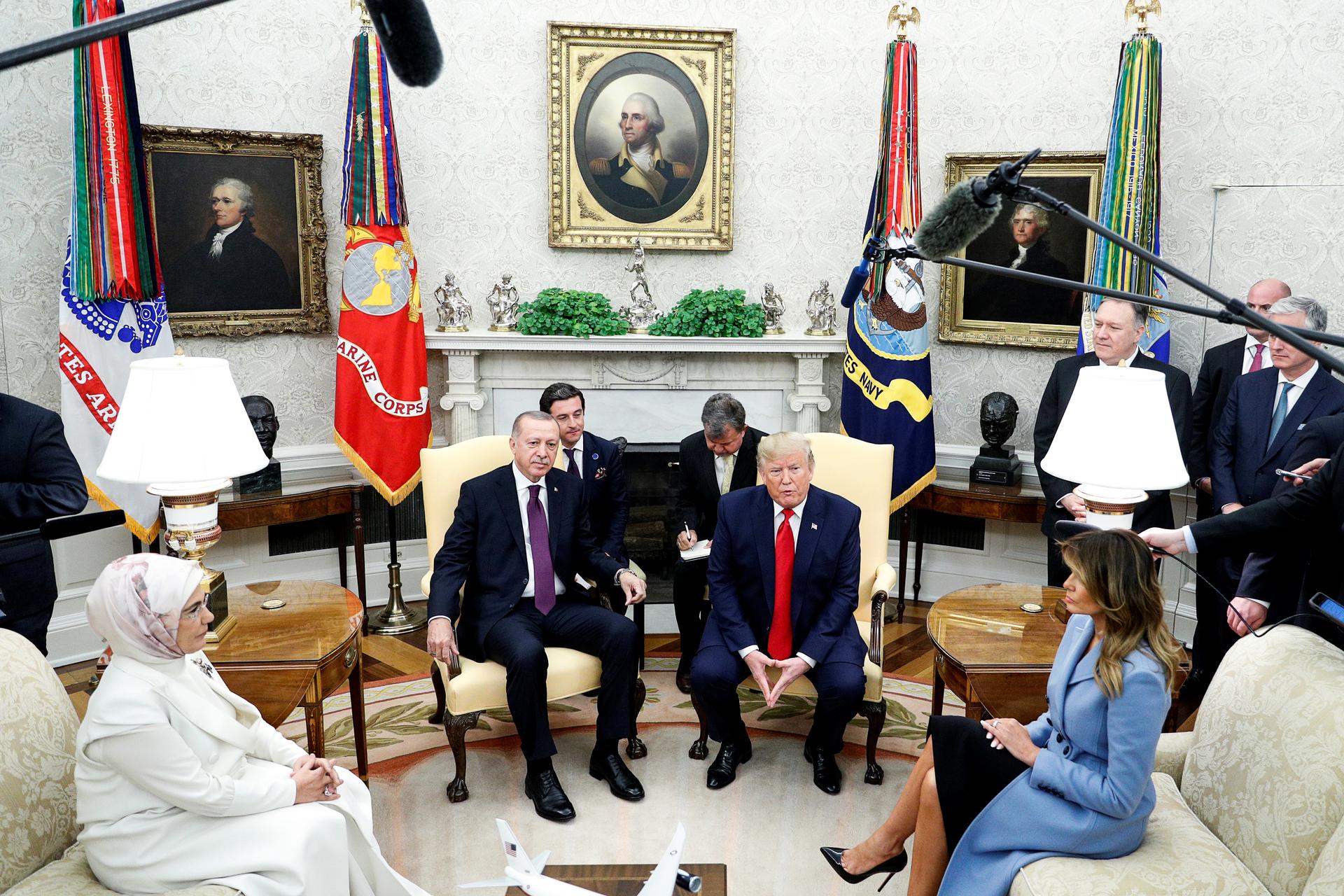 US President Donald Trump and first lady Melania Trump meet with Turkey's President Tayyip Erdogan and Emine Erdogan in the Oval Office of the White House in Washington, D.C., on November 13, 2019.