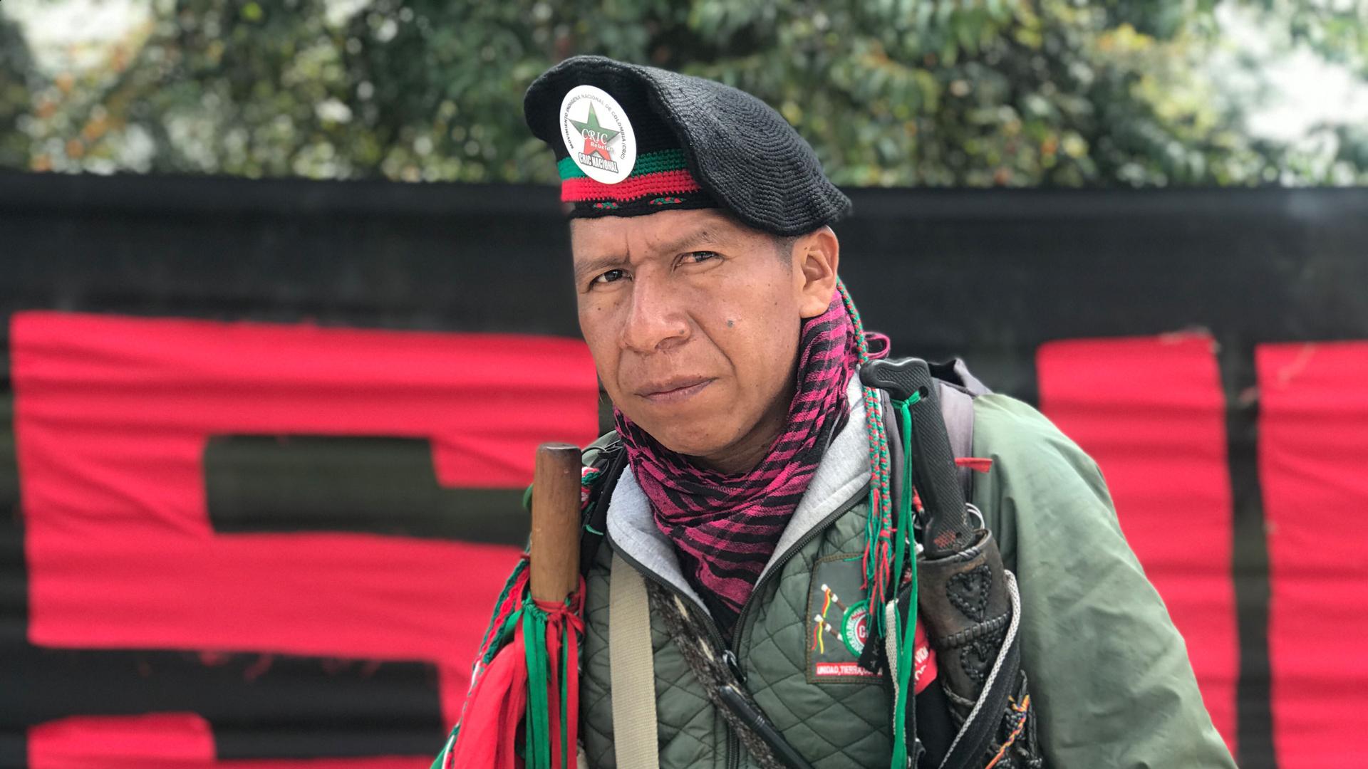 Jose Albeiro Camayo is show in a close-up photograph wearing a red beret.