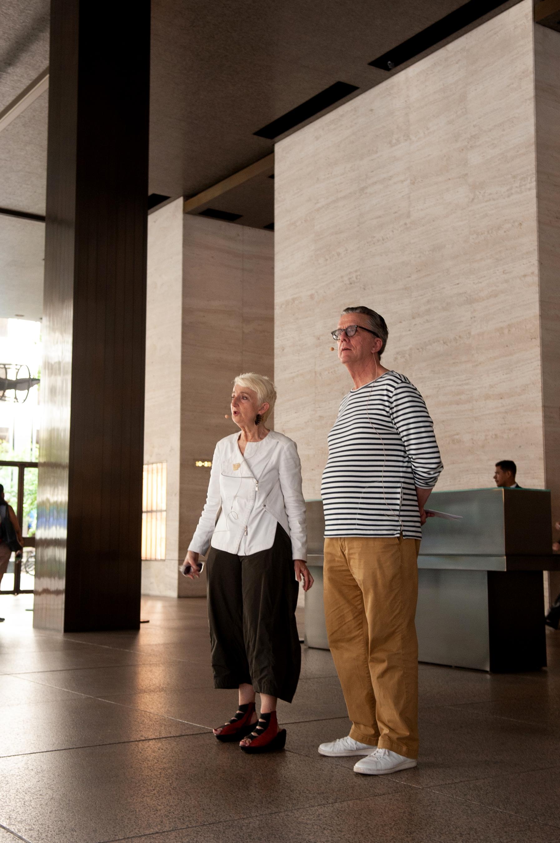 Frances Bronet and Kurt Andersen stand in the Seagrams lobby.