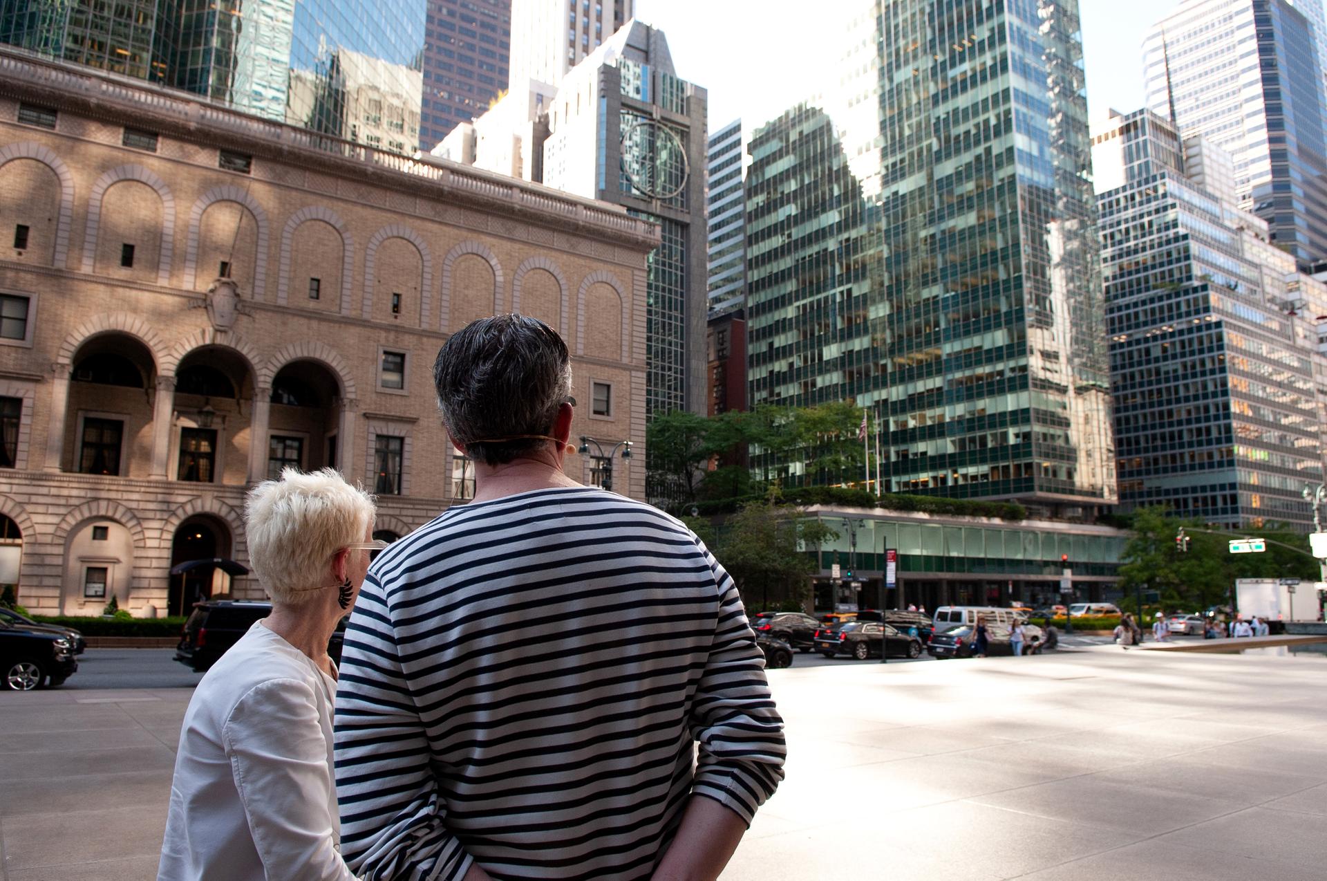 Frances Bronet and Kurt Andersen look at the Lever House building (right) from the Seagrams plaza.