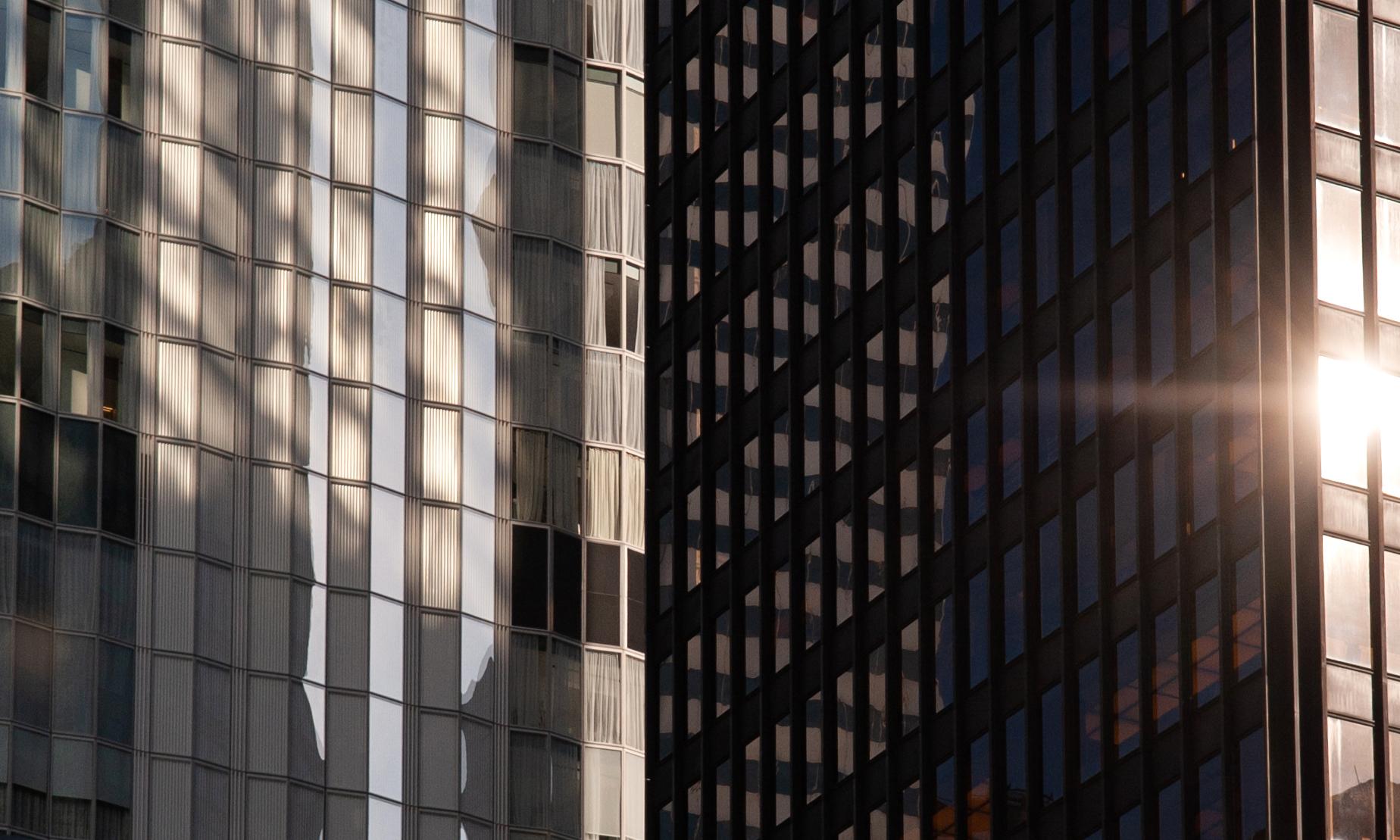 The sun reflects off the Seagrams Building (foreground) in Midtown Manhattan.