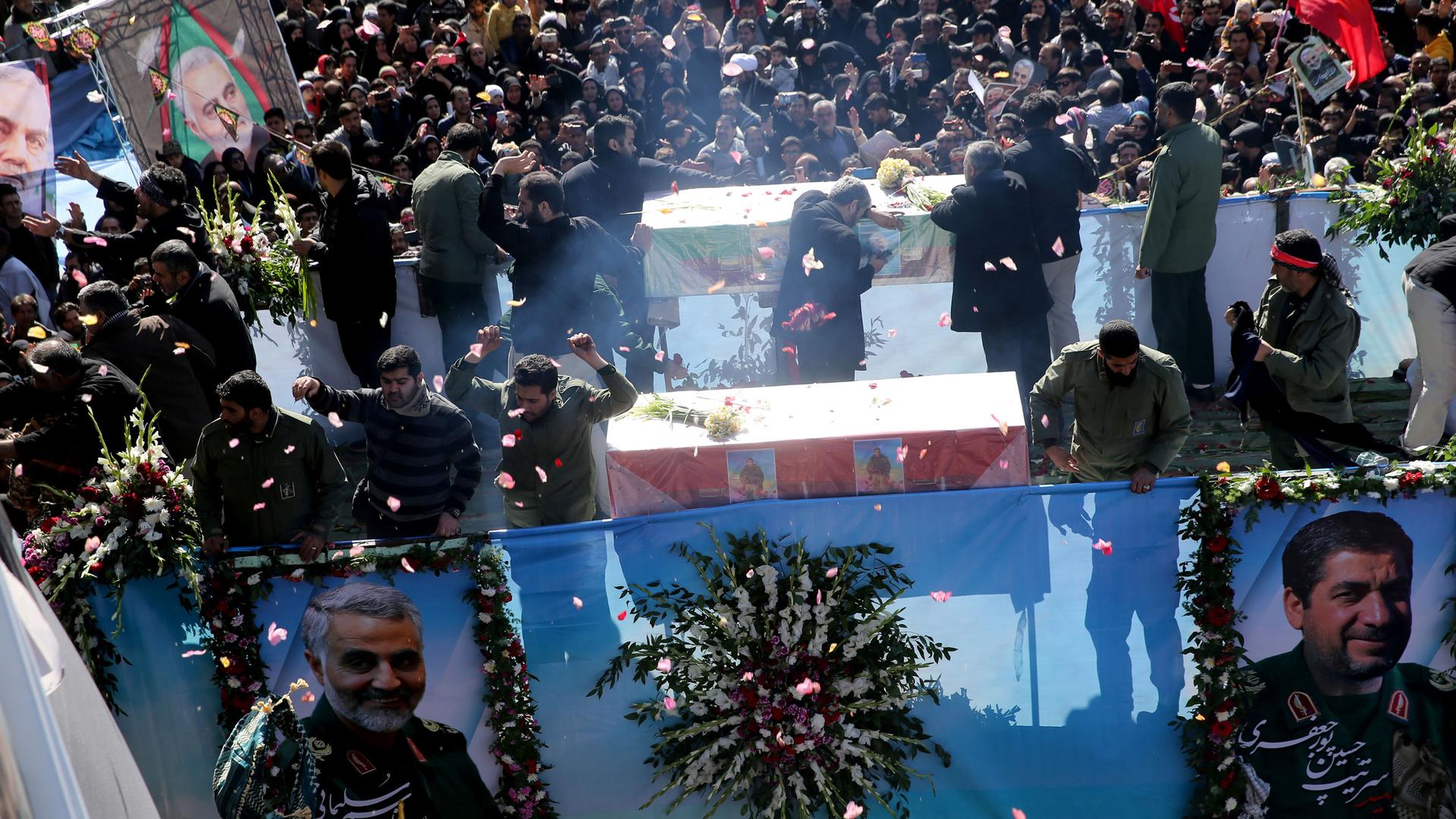 Iranian people attend a funeral procession and burial for Iranian Major-General Qasem Soleimani, head of the elite Quds Force, who was killed in an airstrike at Baghdad airport, at his hometown in Kerman, Iran, Jan. 7, 2020.