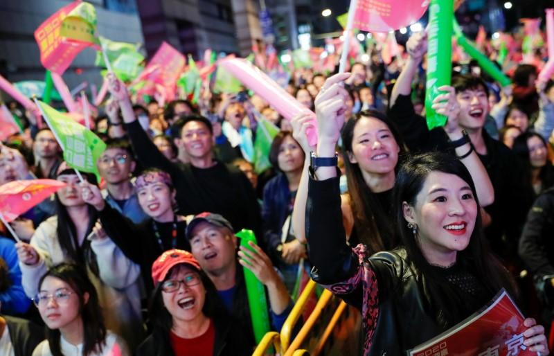Supporters of Taiwan President Tsai Ing-wen react during a rally outside the Democratic Progressive Party (DPP) headquarters in Taipei, Taiwan, on January 11, 2020.