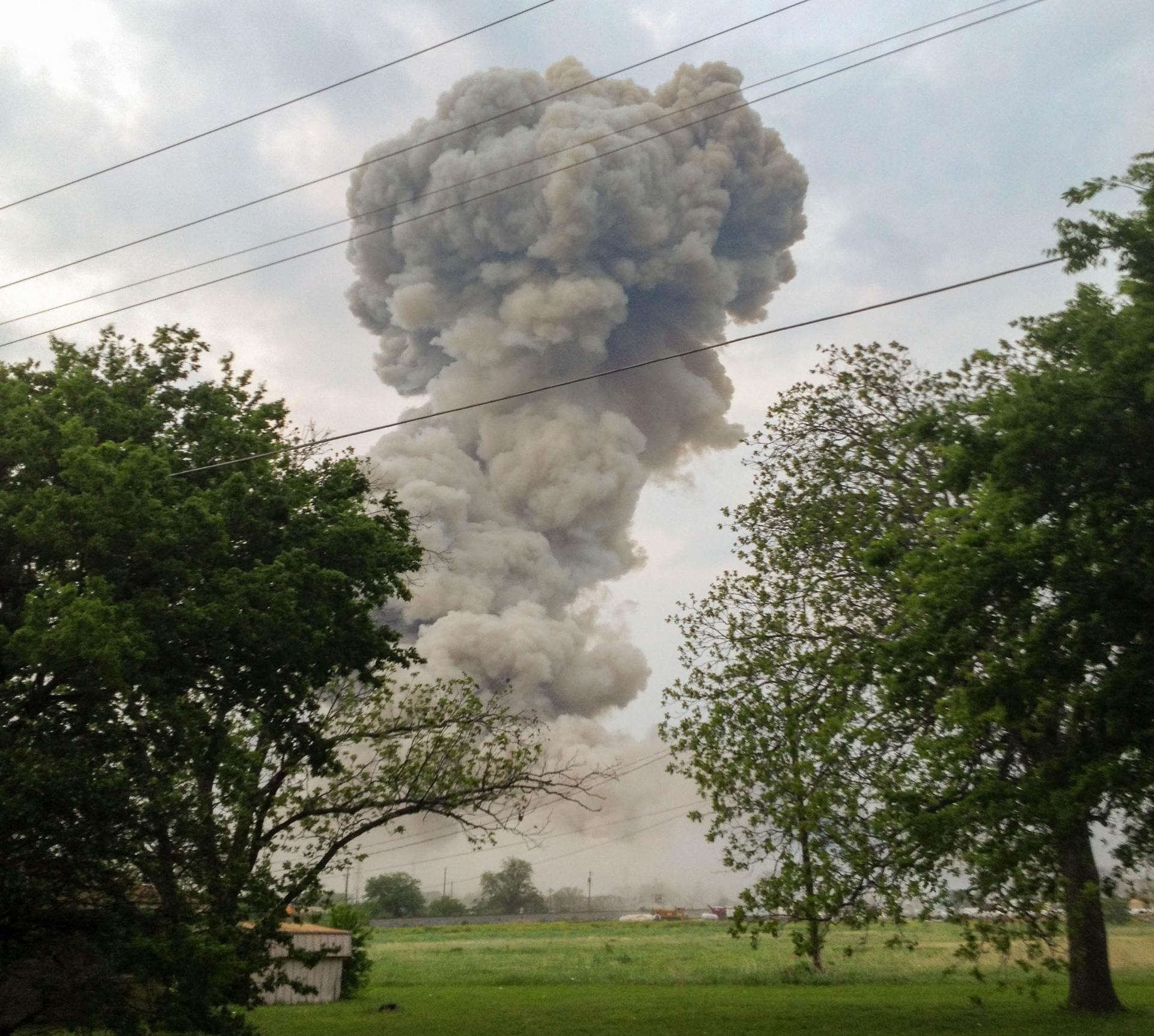 A plume of smoke is seen in the distance following an explosion.