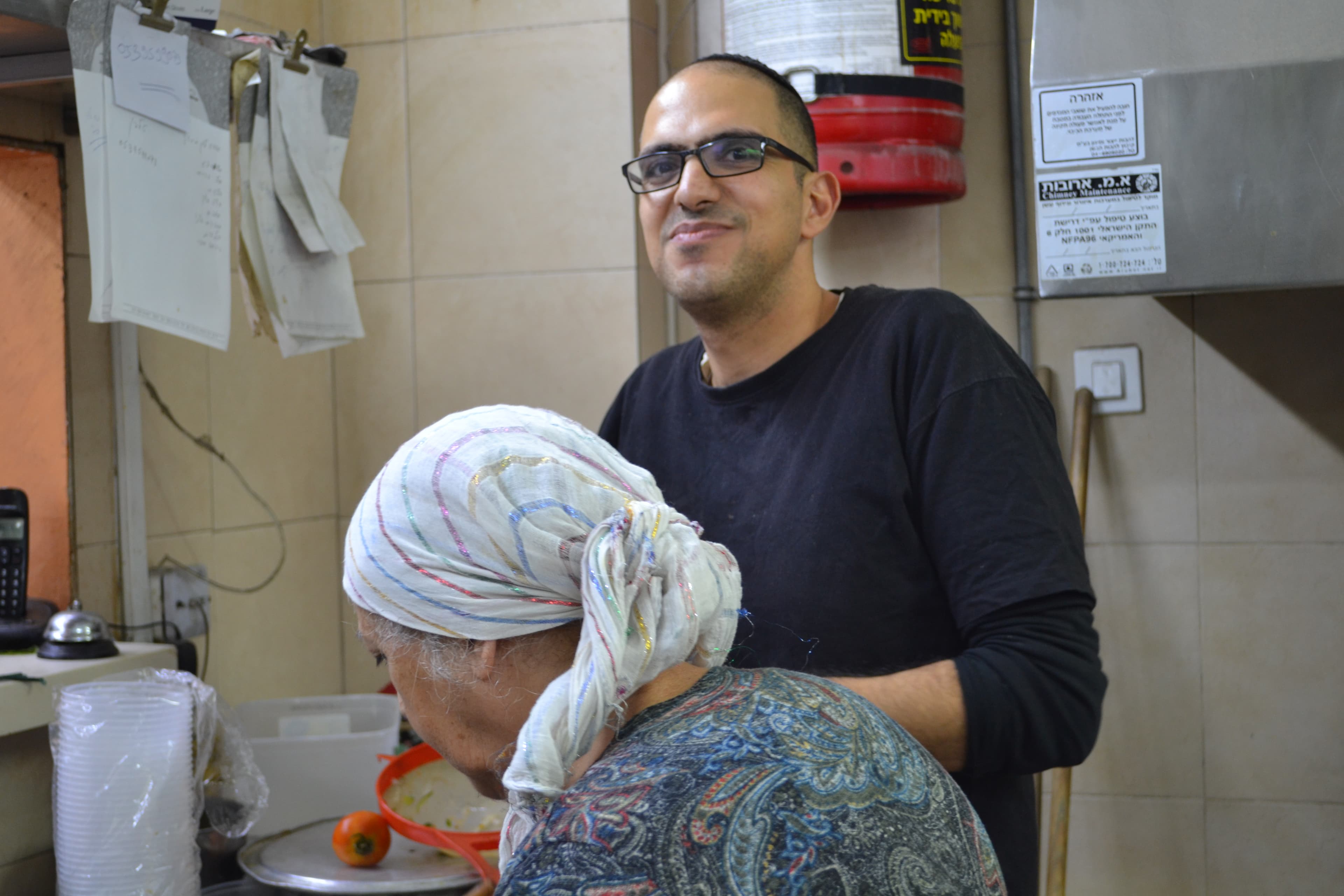 Avi Hanasav with his mother Moluk Hanasav at Shamshiri, the Persian restaurant they own together in Tel Aviv, Israel.