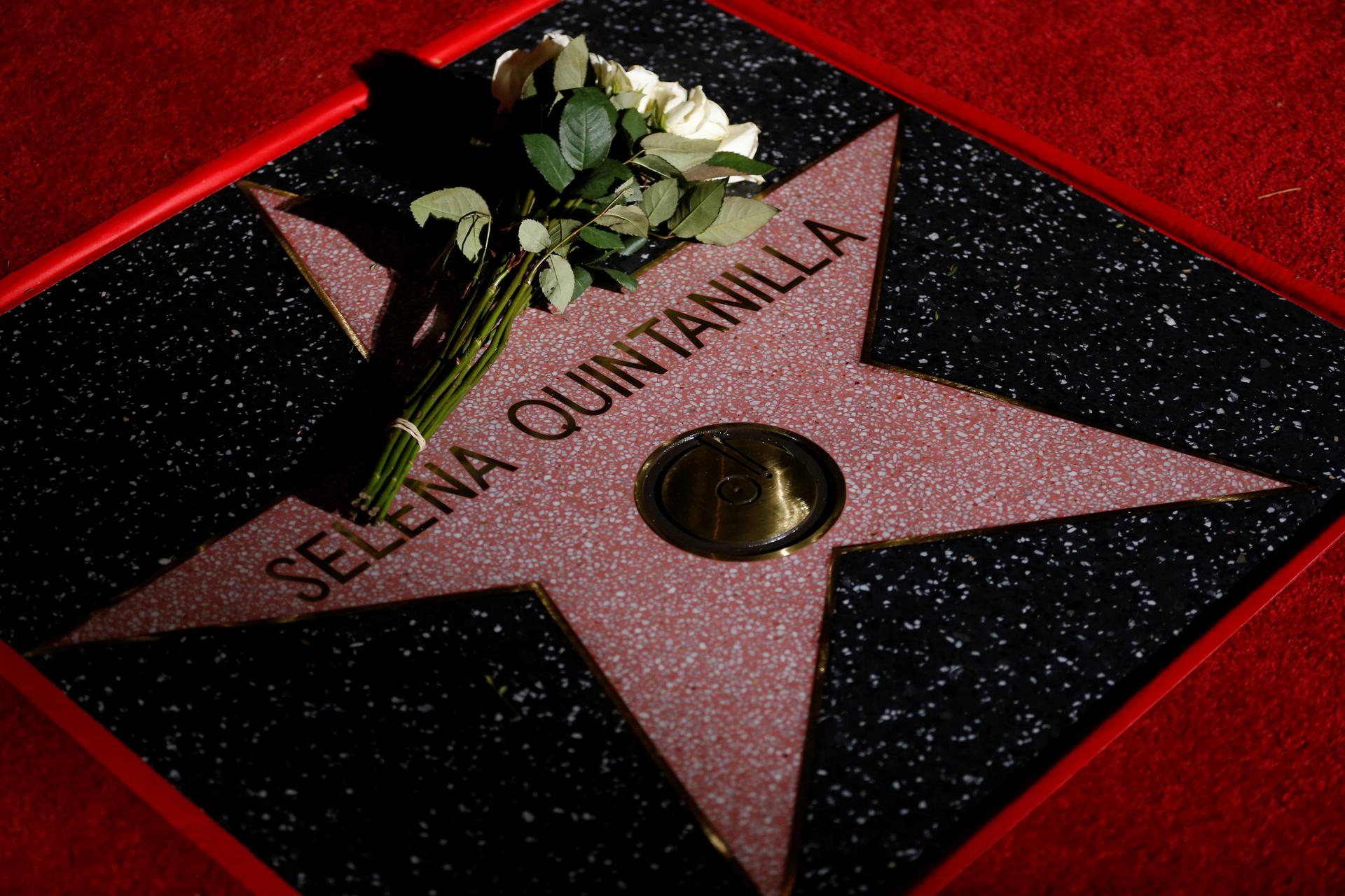Flowers are seen on the star of late singer Selena Quintanilla-Perez after it was unveiled on the Hollywood Walk of Fame in Los Angeles, California, on November 3, 2017. 